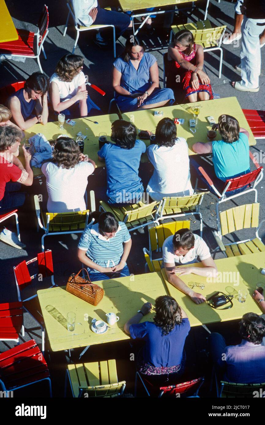 Young people sitting at café tables in 1982, Marburg, Hessen, Germany Stock Photo