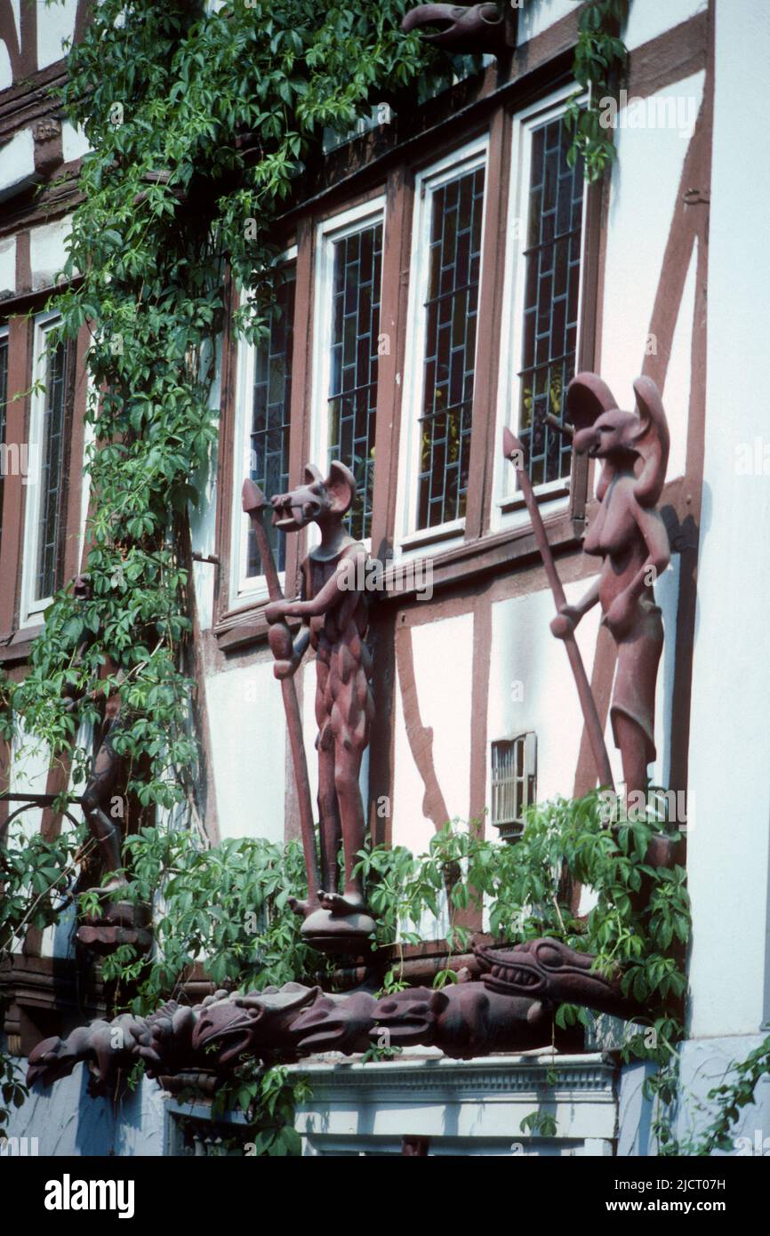 House with grotesque figures on the outside in 1982, Limburg, Hessen, Germany Stock Photo