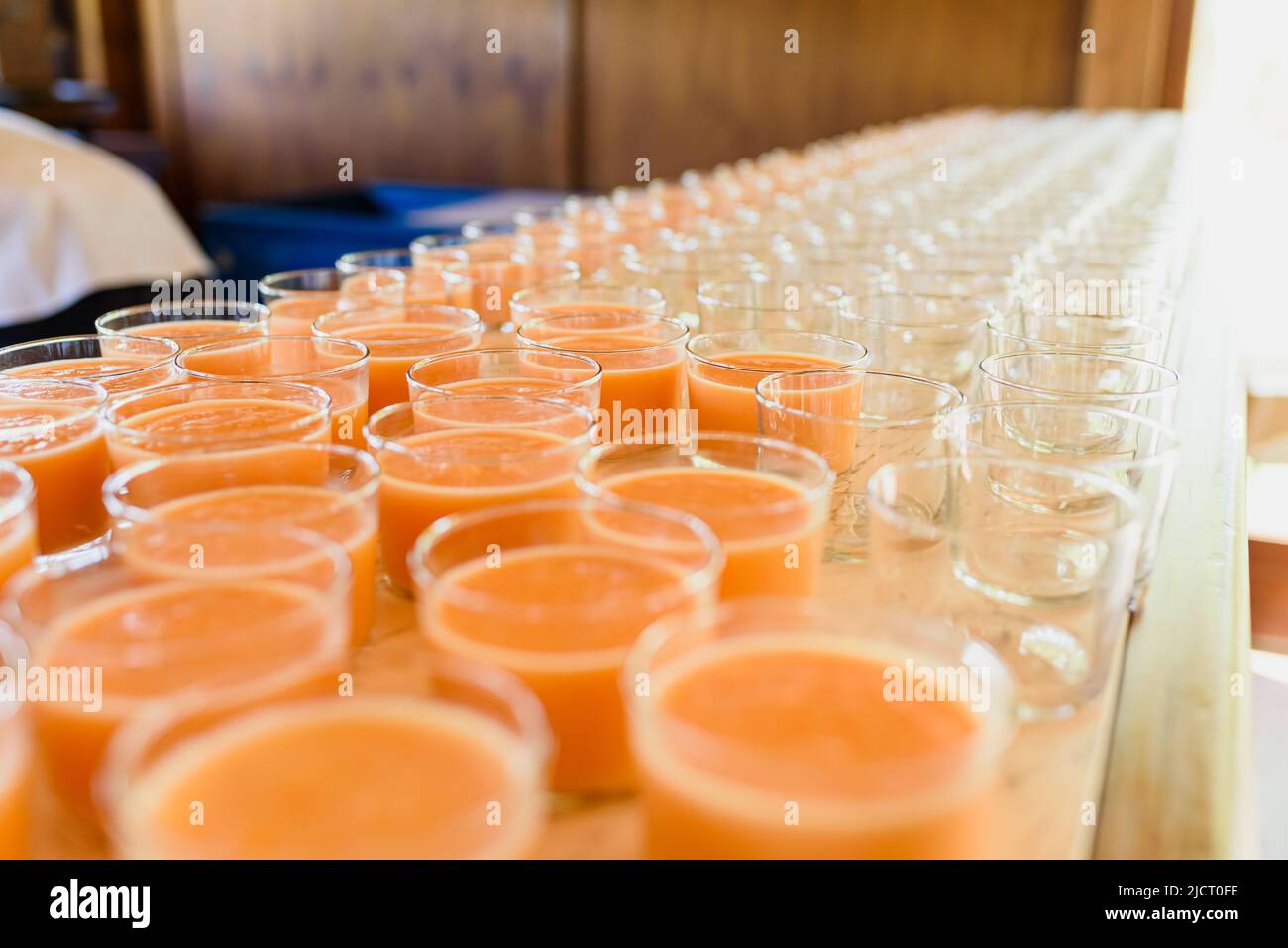 Counter of a restaurant with many glasses of healthy fruit drink. Stock Photo