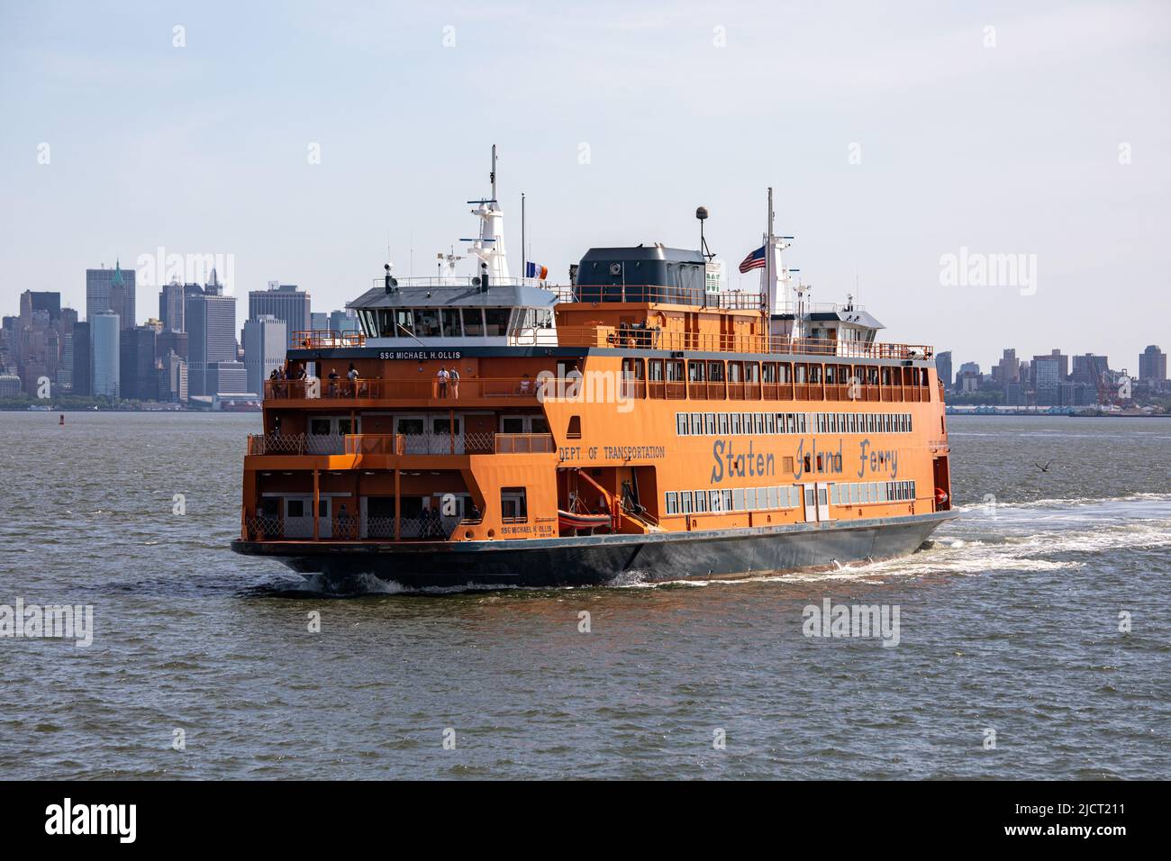 SSG Michael H. Ollis ferry approaching Staten Island with lower Manhattan high-rise buildings in the background in New York City, United States Stock Photo