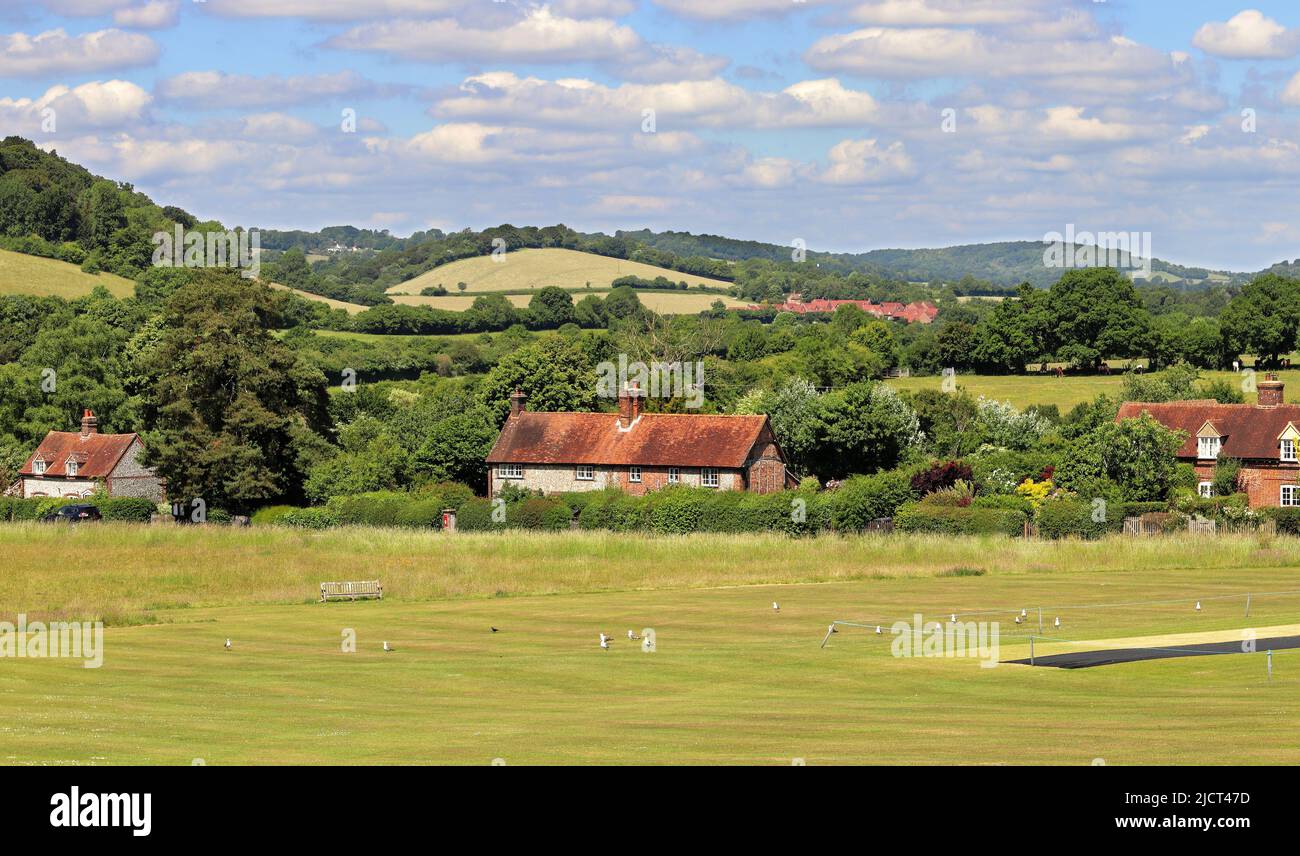 An English Rural Landscape in th Chiltern Hills in the Hamlet of Bradenham in Buckinghamshire with cricket field in the foreground Stock Photo