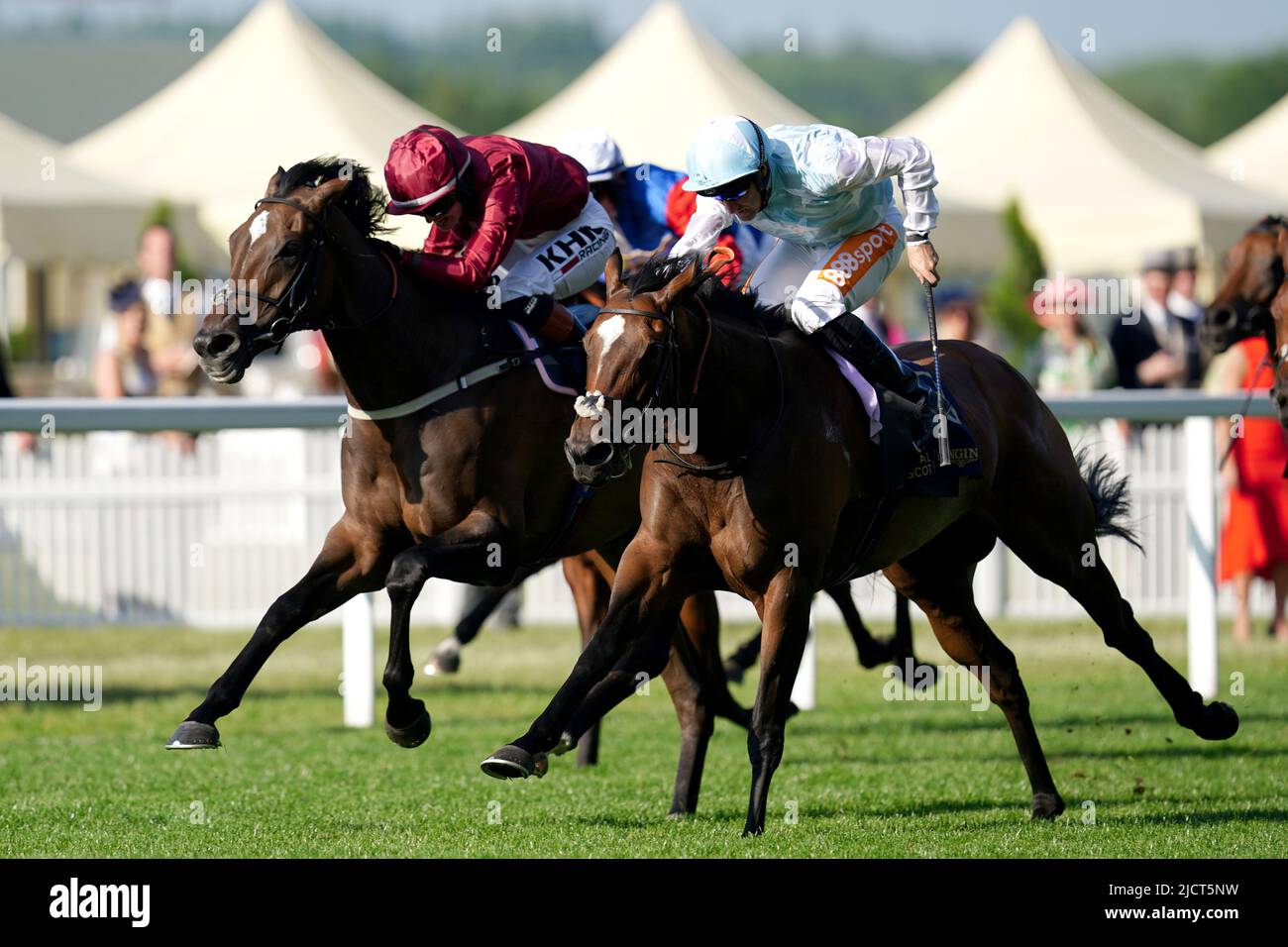 Rising star (right) ridden by Neil Callan comes home to win The Kensington Palace Stakes from second placed Random Harvest, (left) ridden by Saffie Osborne during day two of Royal Ascot at Ascot Racecourse. Picture date: Wednesday June 15, 2022. Stock Photo