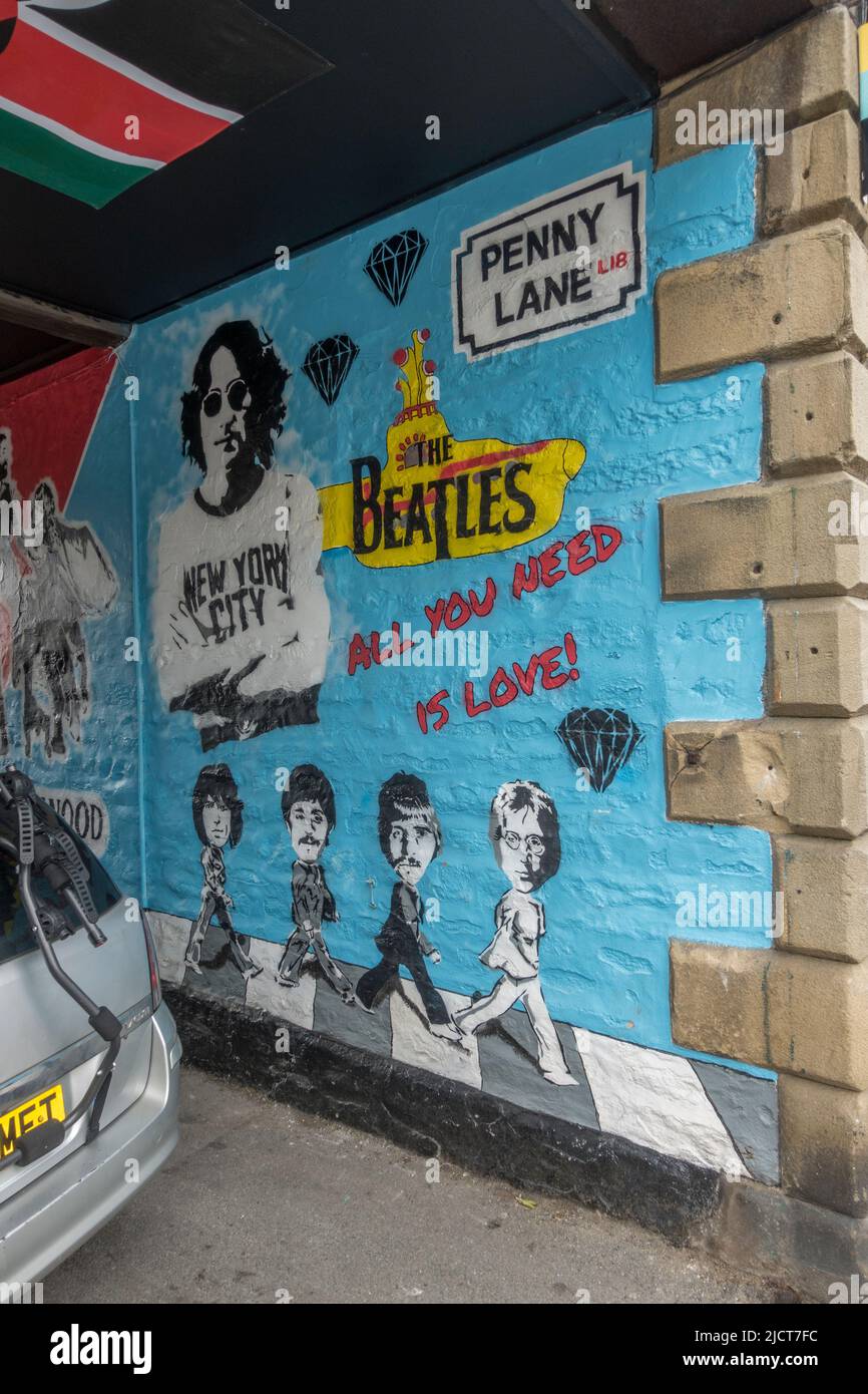 'The Beatles' artwork on an alley wall (off Coach Street) in the market town of Skipton, North Yorkshire, UK. Stock Photo