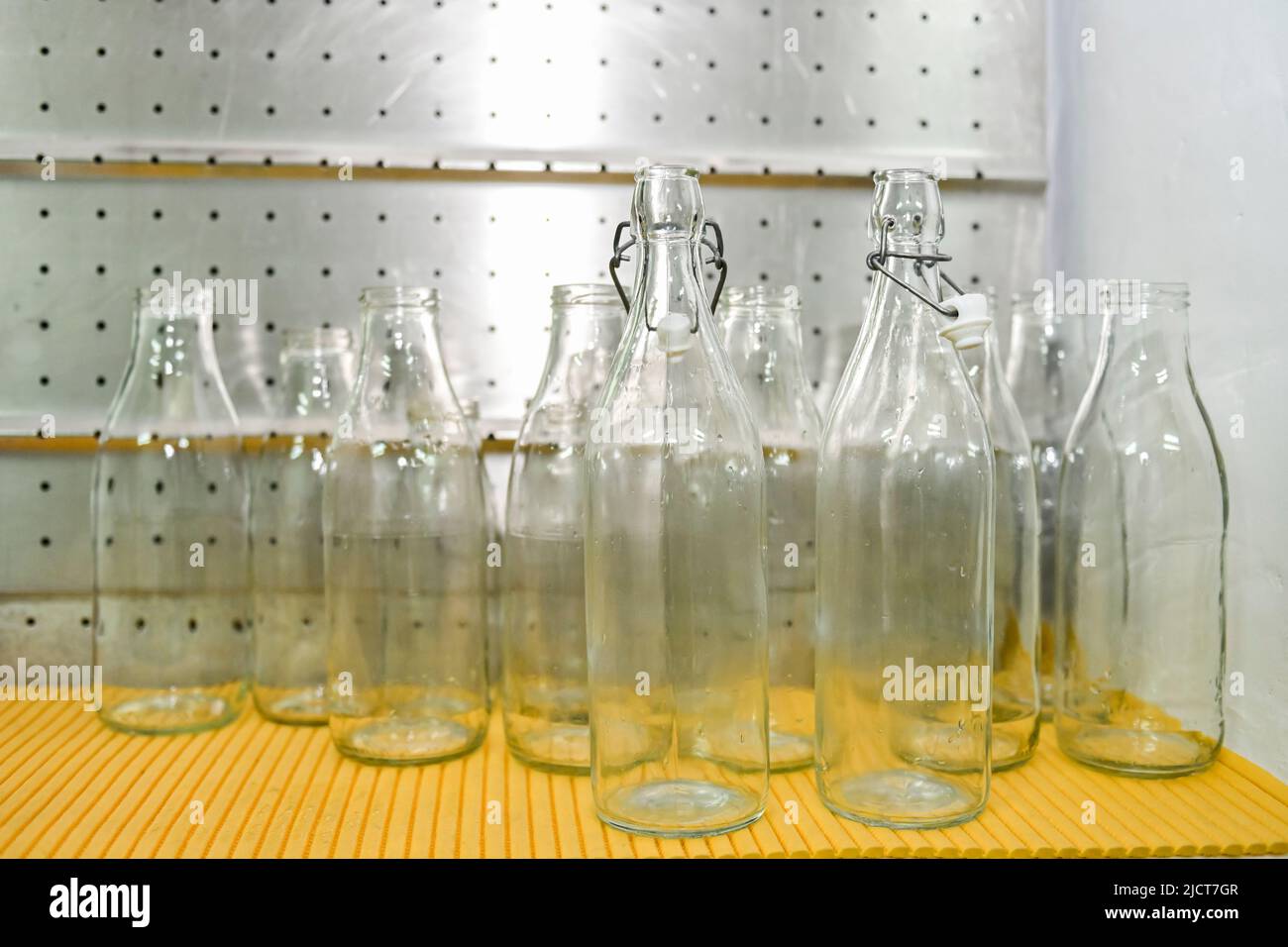 Clean glass bottles, for filling milk Stock Photo Alamy