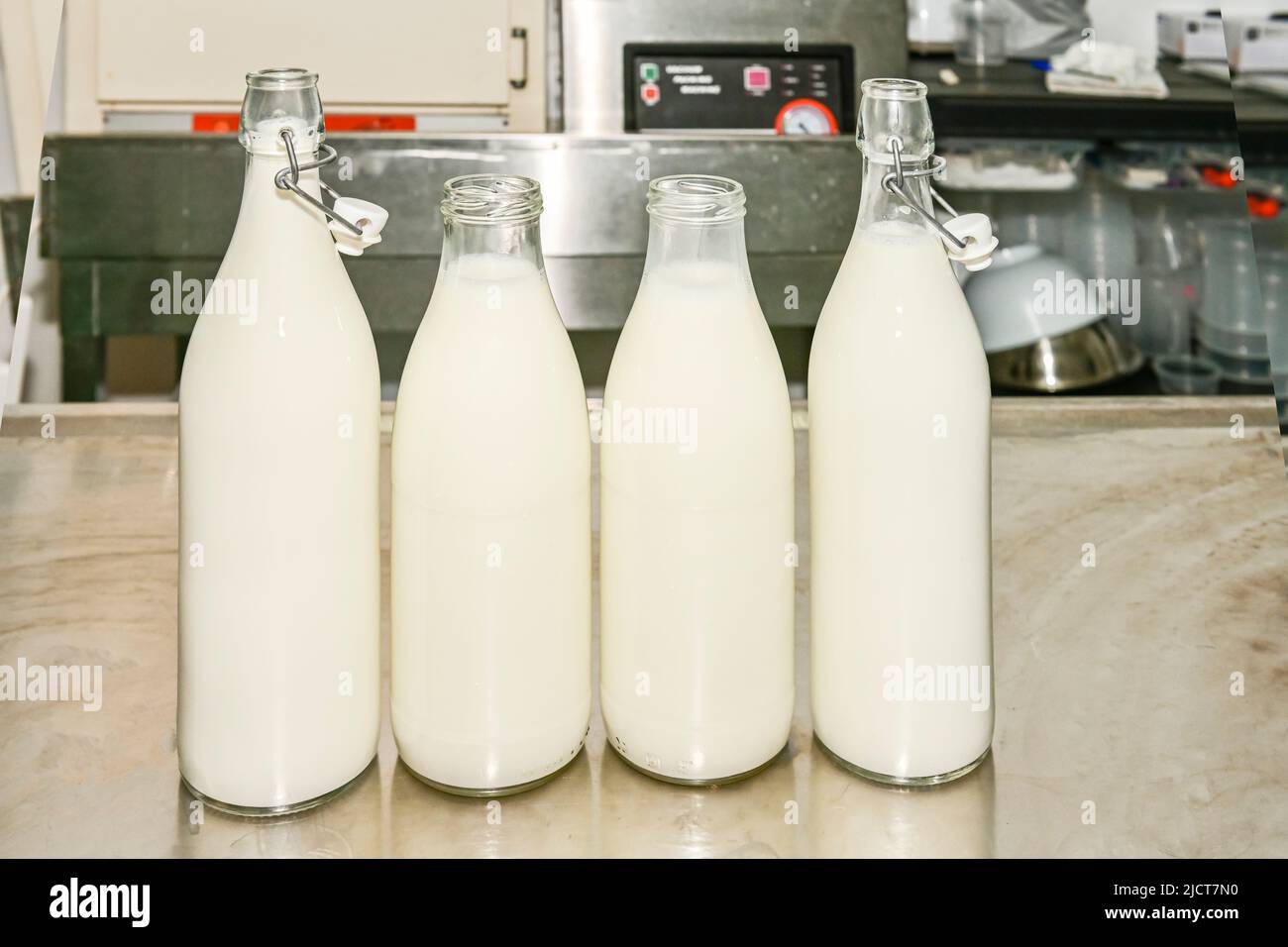 Glass bottles, filled with fresh goat's milk Stock Photo Alamy