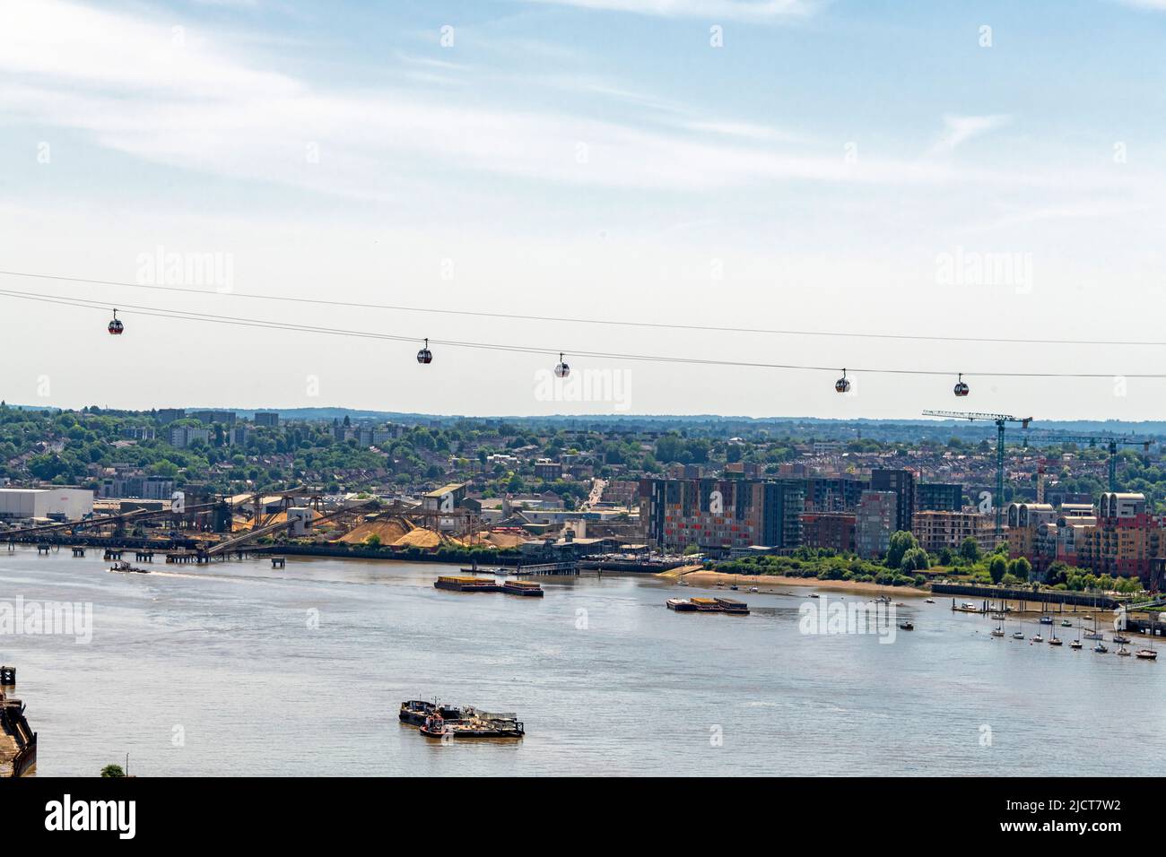 Aerial photo of the Emirates Royal Docks Gondola crossing the River Thames at Greenwich Peninsular. Stock Photo