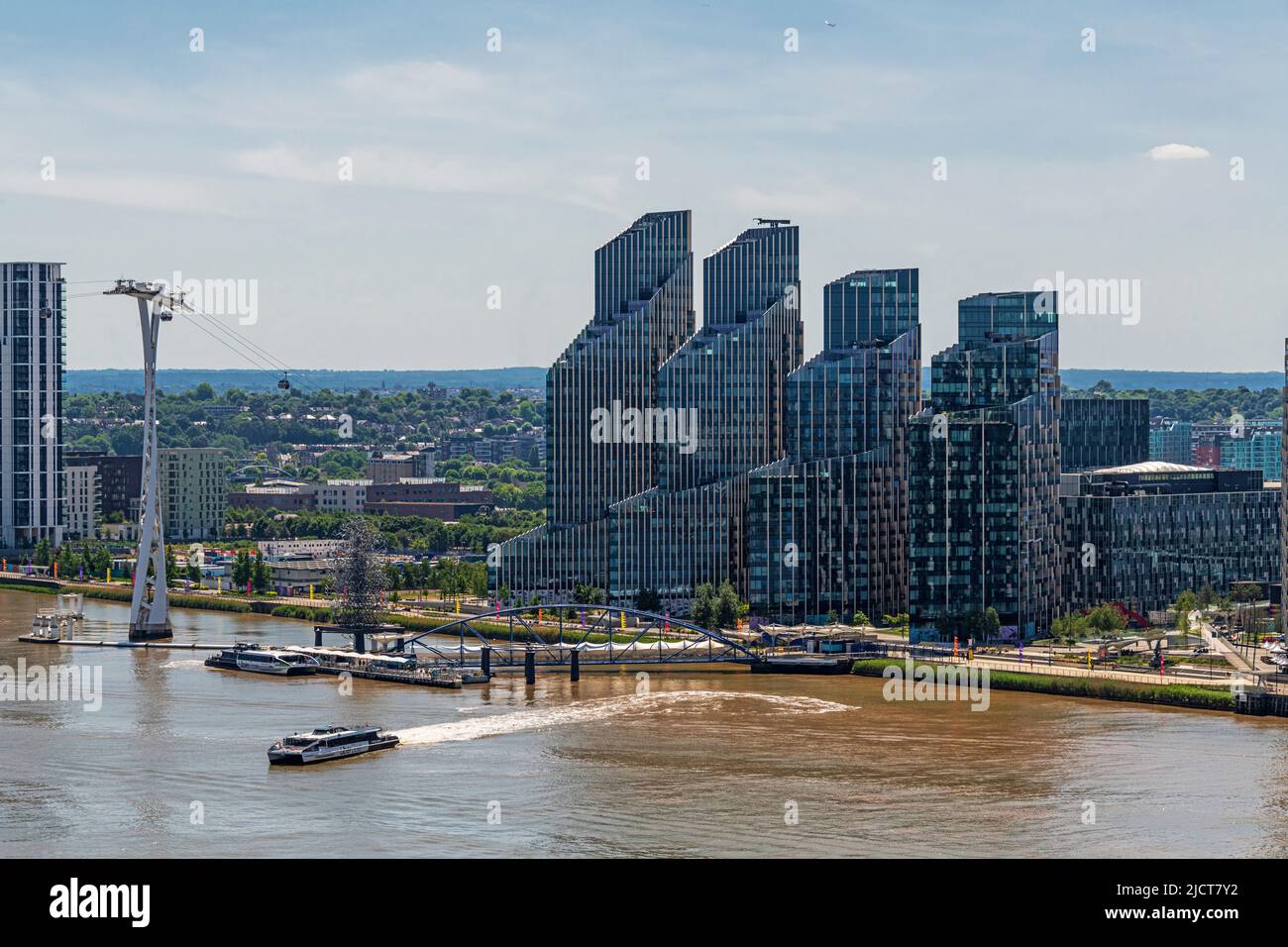 Aerial Views over the River Thames towards Greenwich Peninsular, and North Greenwich Pier and Ferry Terminal London. Stock Photo