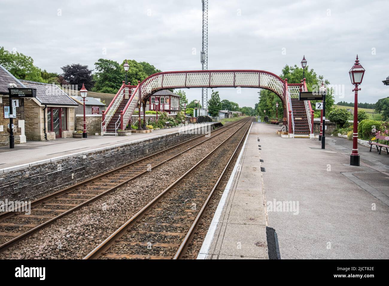 The footbridge over the railway line at Settle in North Yorkshire, England, UK Stock Photo