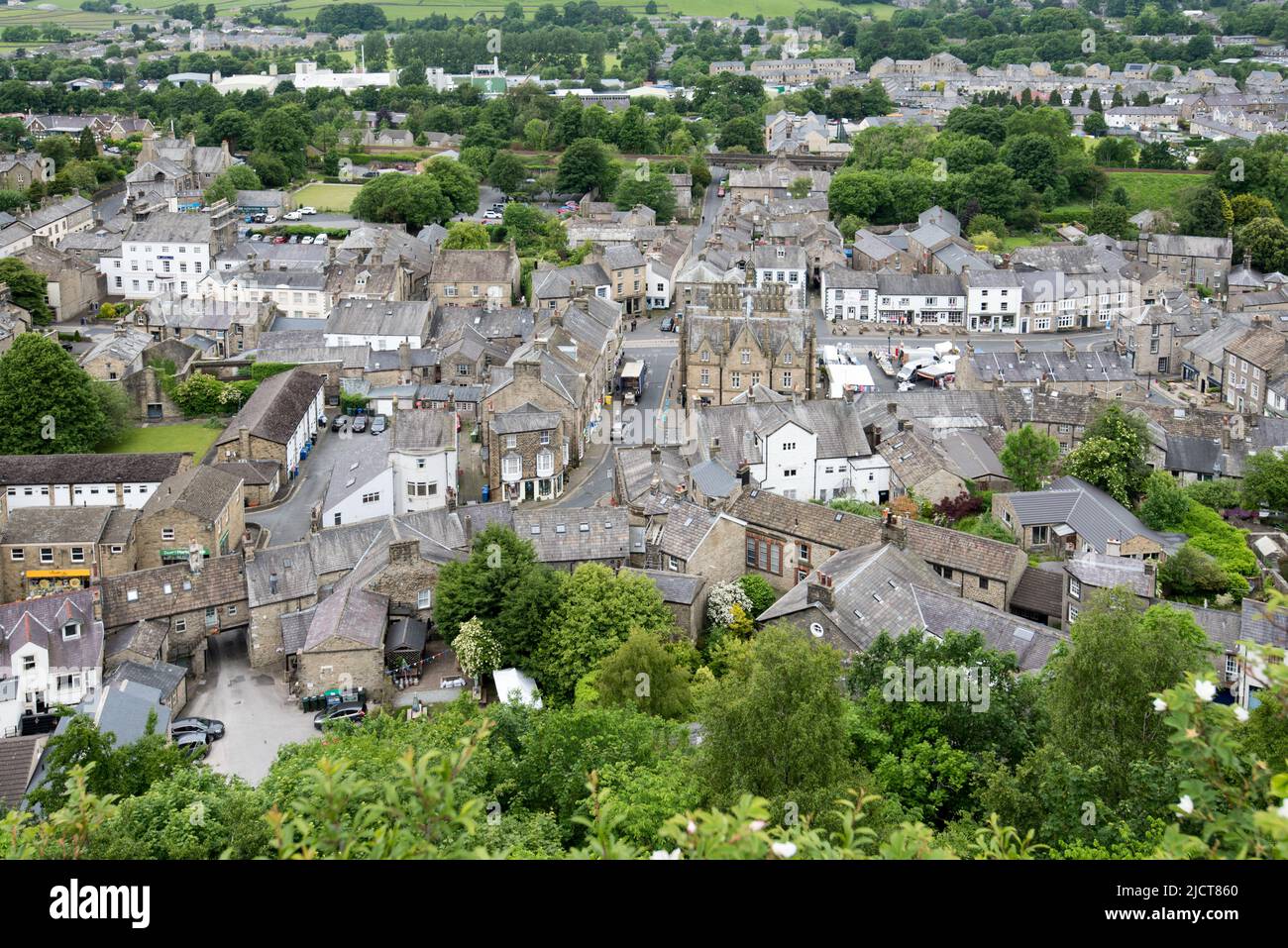 The market town of Settle on 14th June 2022 (Tuesday Market day), seen from the top viewing point on Castlbergh Hill Stock Photo
