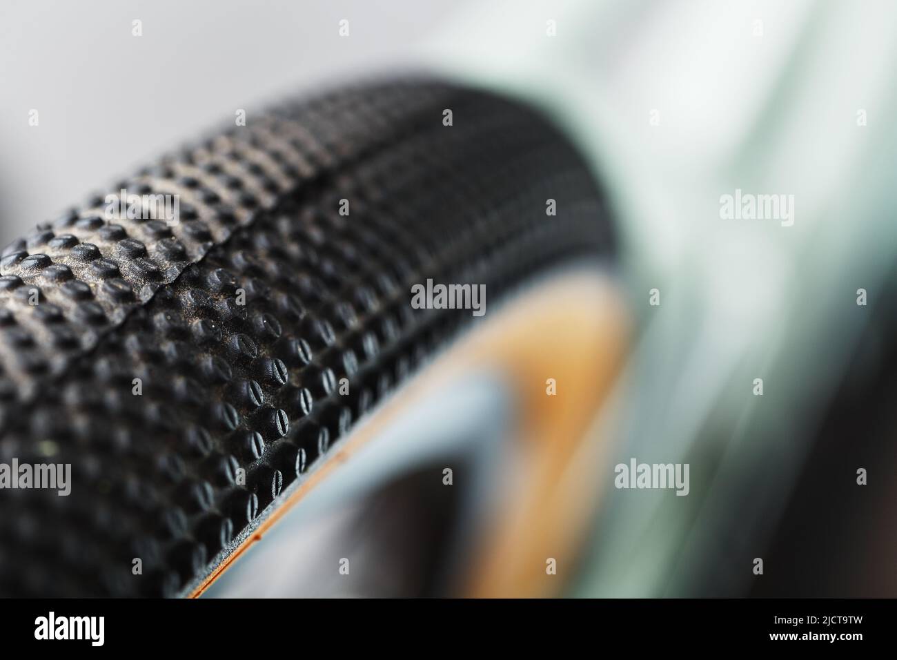 Shallow tread of a bicycle tubeless tire with a brown sidewall close-up Stock Photo