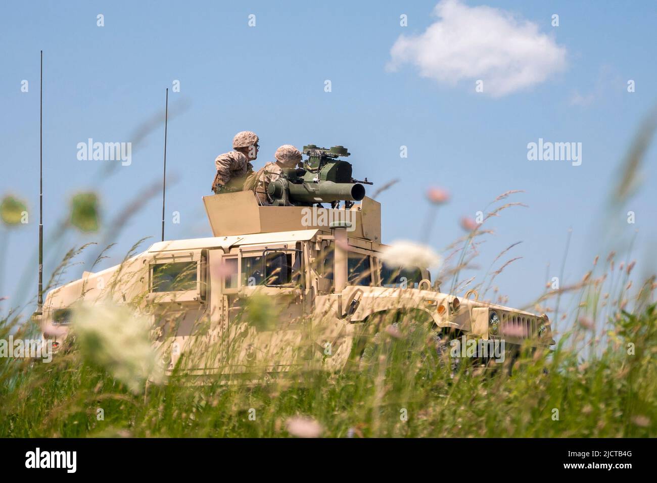 May 20, 2022 - Fort Campbell, Kentucky, USA - U.S. Reserve Marines assigned to the Combined Anti-Armor Team, Weapons Company, 3rd Battalion, 23rd Marine Regiment, 4th Marine Division, fire an Humvee-mounted M240B machine gun during a mission rehearsal exercise at Fort Campbell, Kentucky, May 19, 2022. Weapons Company convened with other units from 3/23 at Fort Campbell for a mission rehearsal exercise to prepare for the upcoming Integrated Training Exercise 4-22 in the summer of 2022. The Combined Anti-Armor Team Marines conducted machine gun ranges and convoy operations with quick reaction dr Stock Photo
