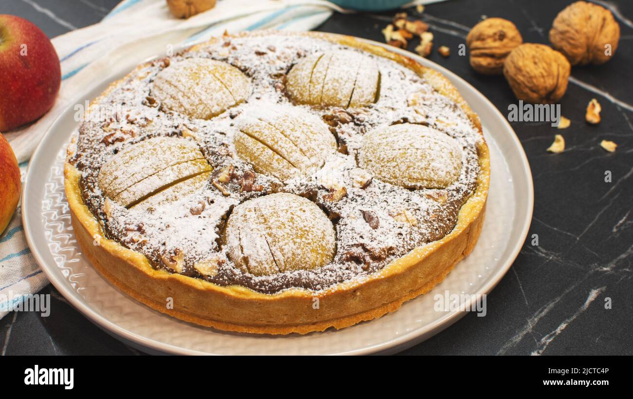 Homemade apple pie pastry on stone table. Bakery and dessert concept. Stock Photo