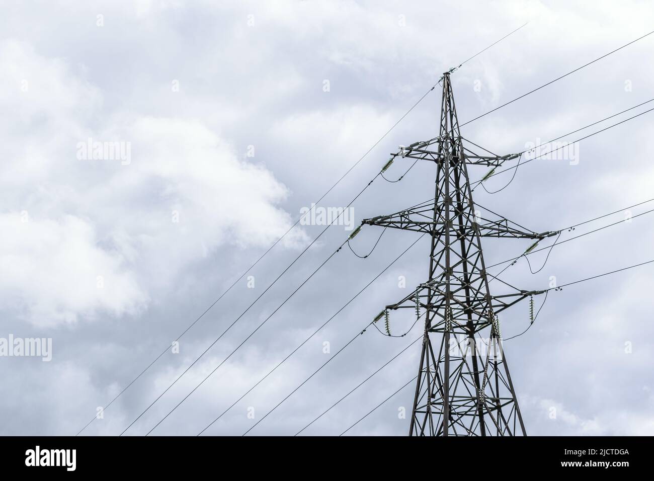 View of a highvoltage overhead power line. Electricity pole on a power