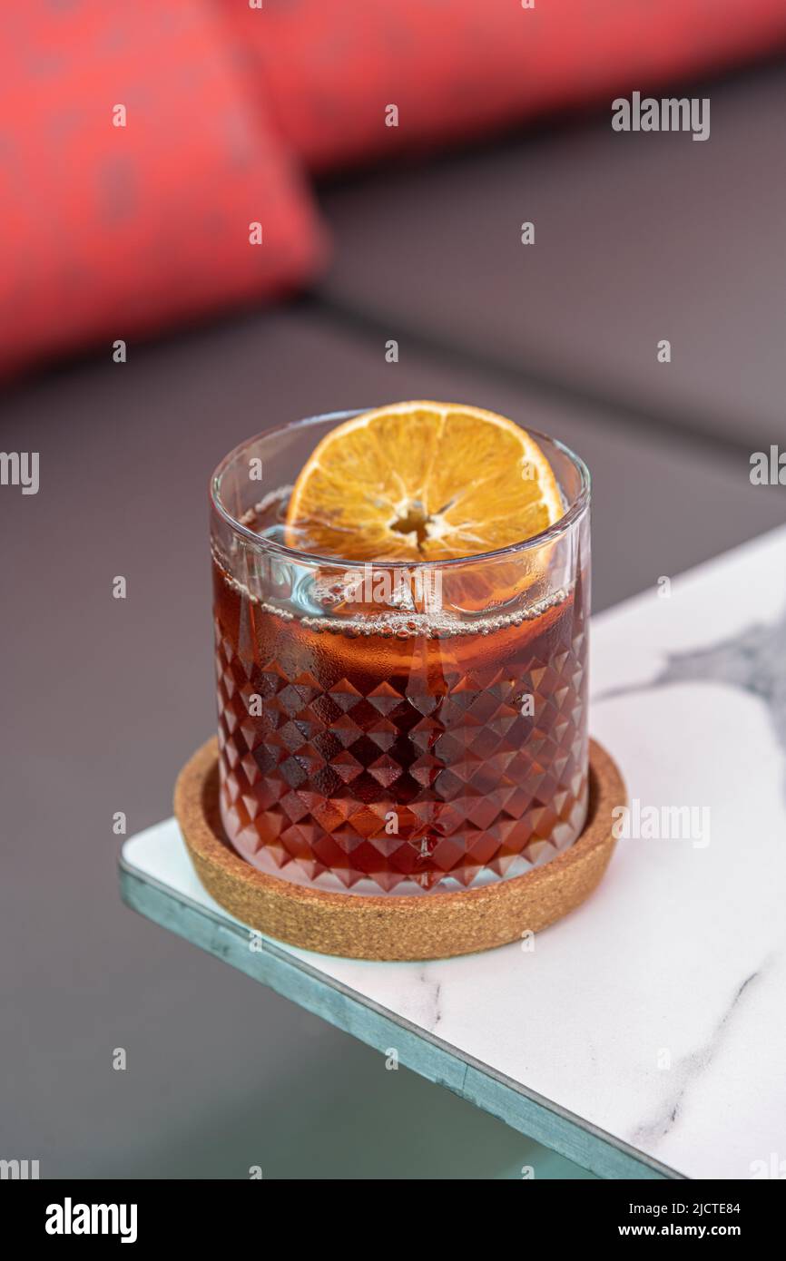 A cup of Iced Americano Coffee or Cold Brew coffee on a marble table in