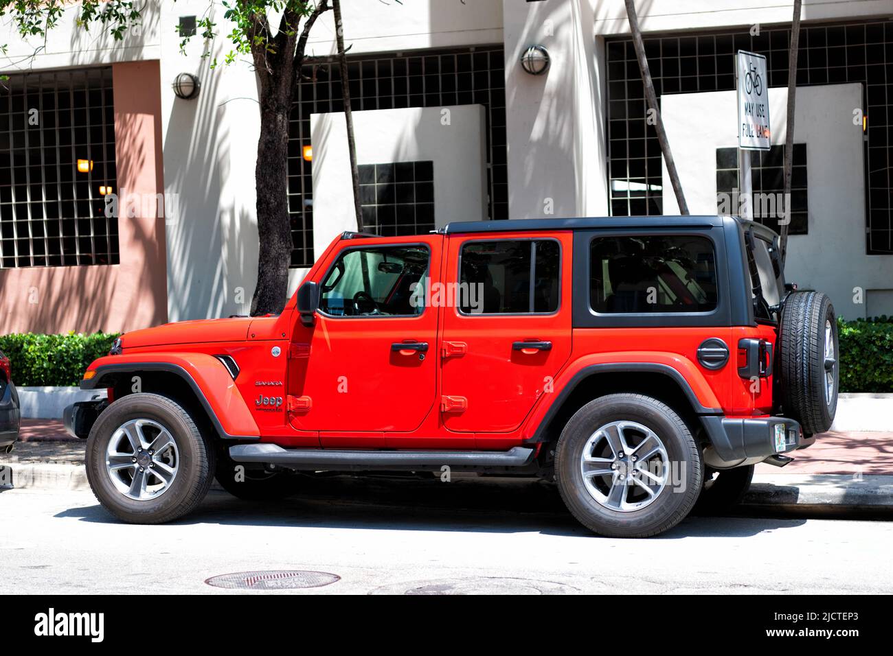 Miami Beach, Florida USA April 14, 2021 red sahara jeep wrangler