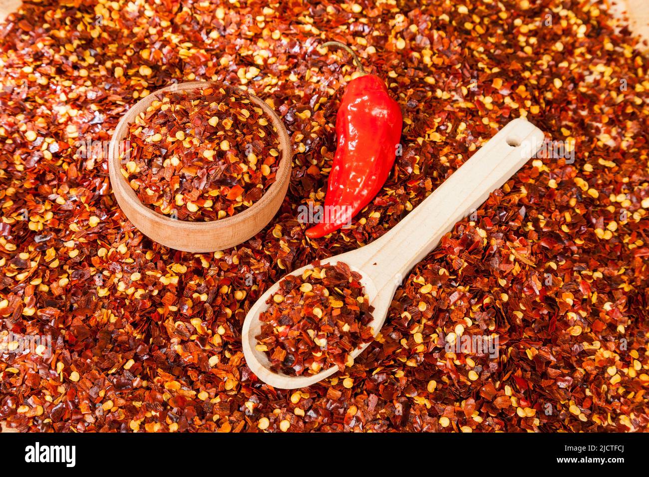Red pepper or cayenne; Pepper crushed with flakes scattered Stock Photo Alamy