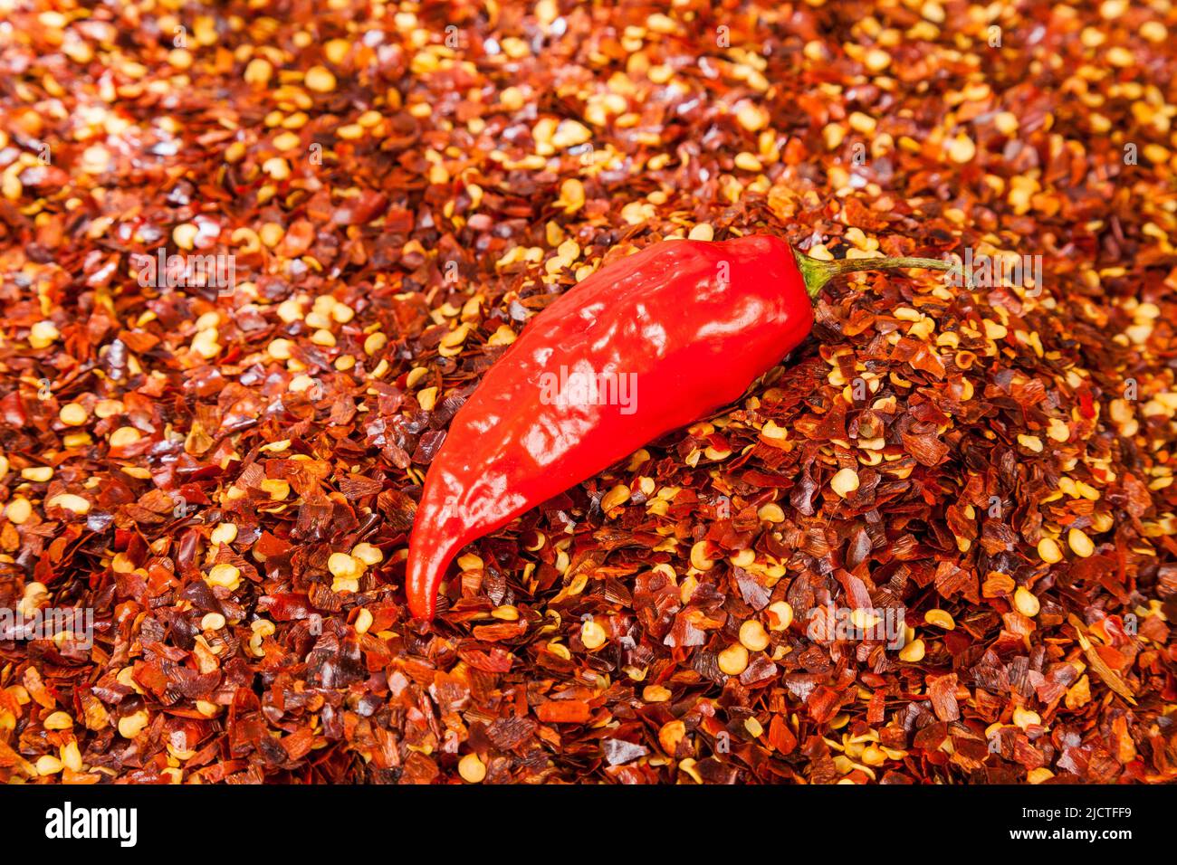 Red pepper or cayenne; Pepper crushed with flakes scattered Stock Photo Alamy