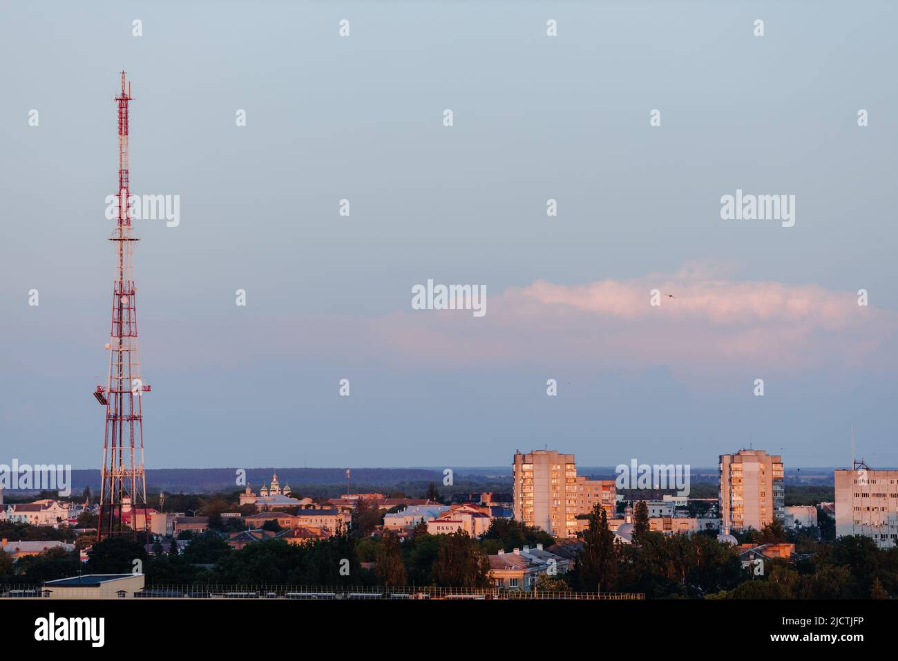 Beautiful sunset sky over the city. Twilight over the urban area. Aerial view. Typical modern residential area. Chernihiv. Ukraine. Horizontal photo. Stock Photo