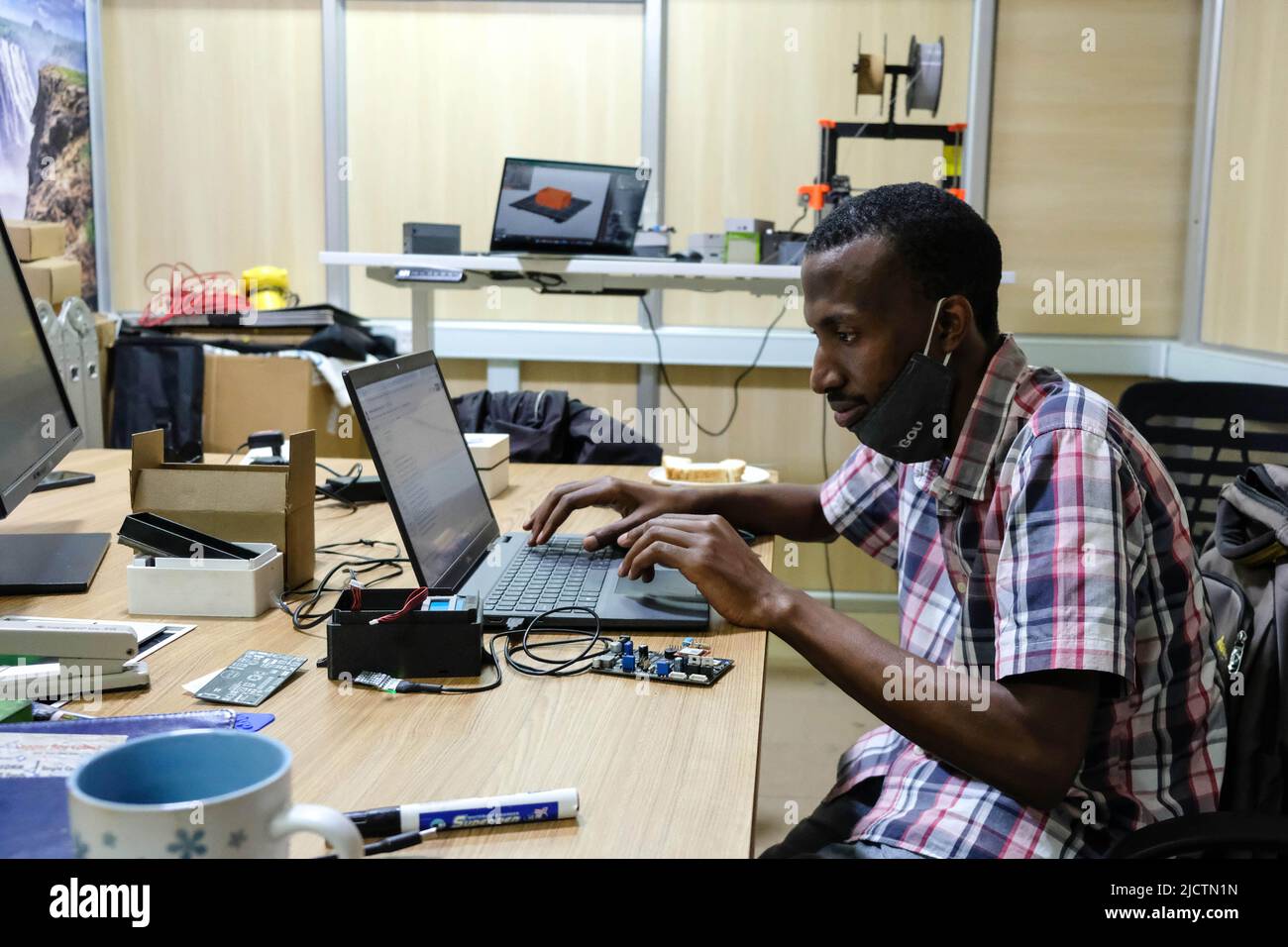 Kampala, Uganda. 31st May, 2022. A technician works inside the AirQo workshop at Makerere University in Kampala, Uganda, on May 31, 2022. TO GO WITH Ugandan scientists build low-cost air quality monitoring system Credit: Hajarah Nalwadda/Xinhua/Alamy Live News Stock Photo