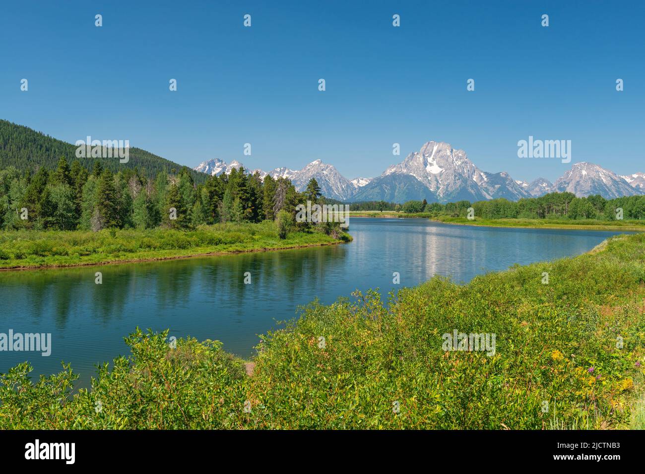 Snake river by Oxbow Bend in summer with Grand Tetons peaks in background, Grand Teton national park, Wyoming, USA. Stock Photo