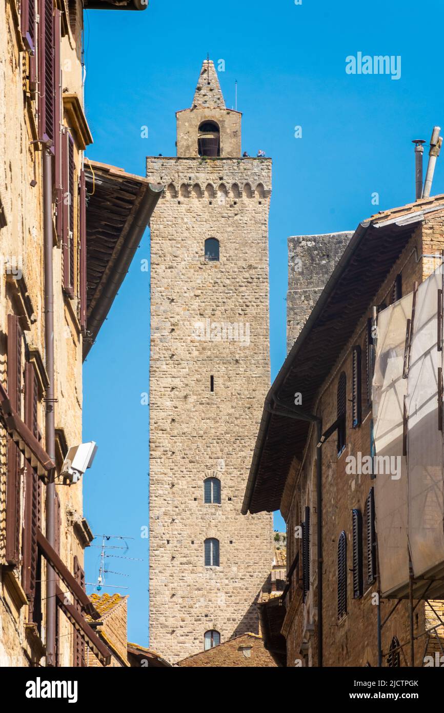 Ancient medieval tower in the town center of San Gimignano, Tuscany ...