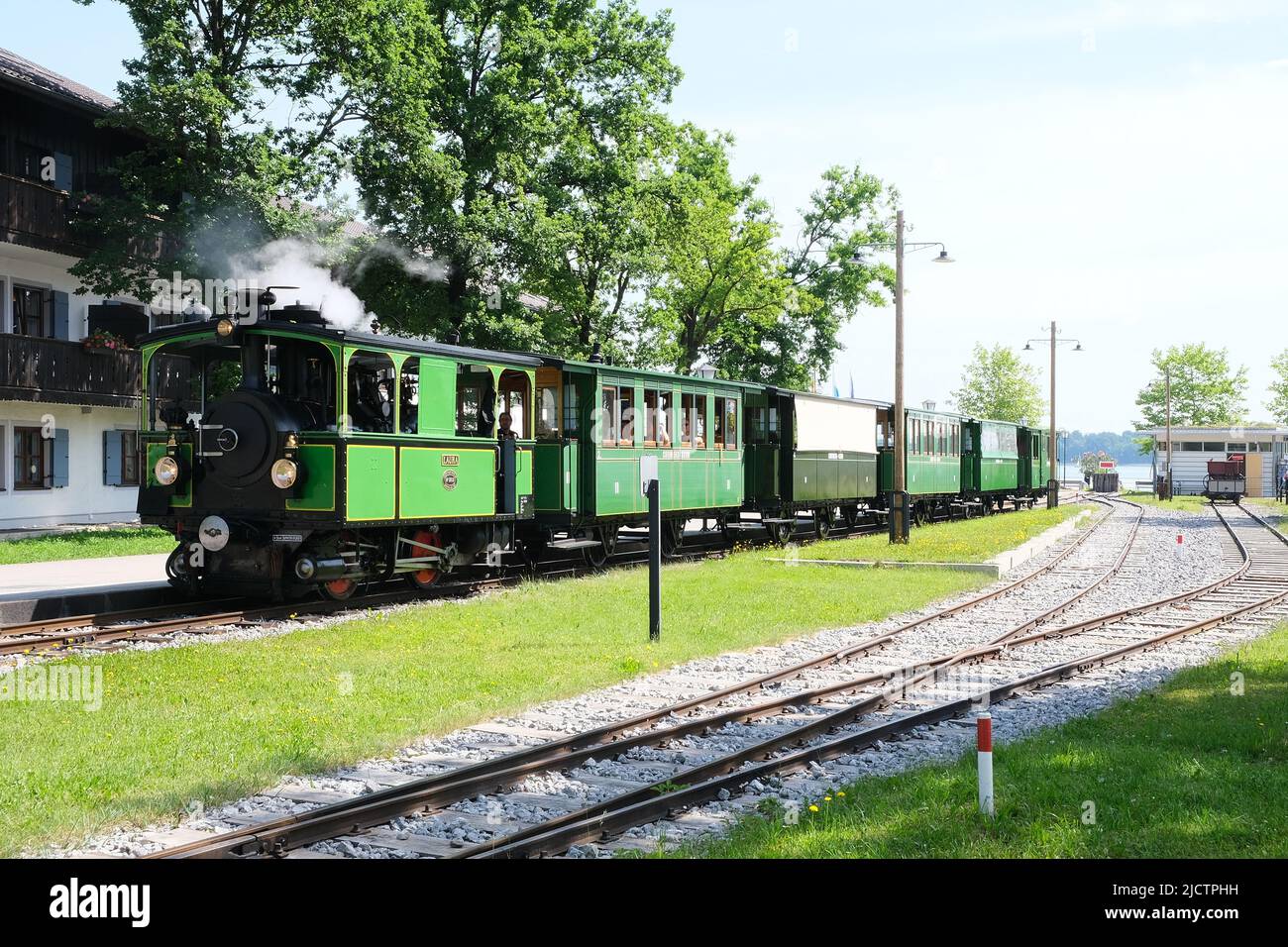 Prien, Bavaria, Germany, June 5, 2022, train of the historic Chiemseebahn with steam locomotive and five passenger cars in Prien harbor. Stock Photo