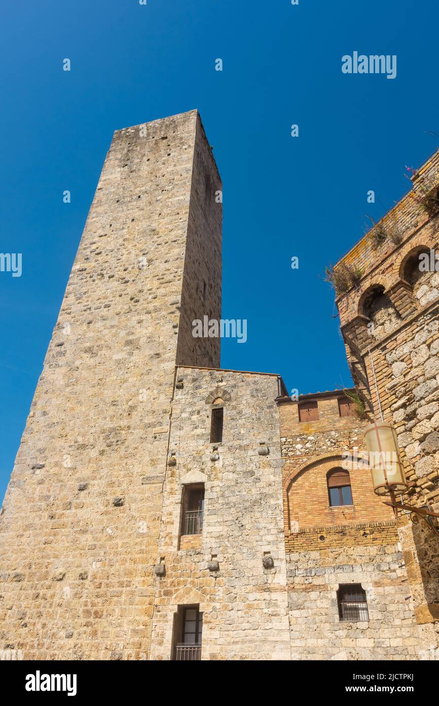Ancient medieval tower in the town center of San Gimignano, Tuscany ...