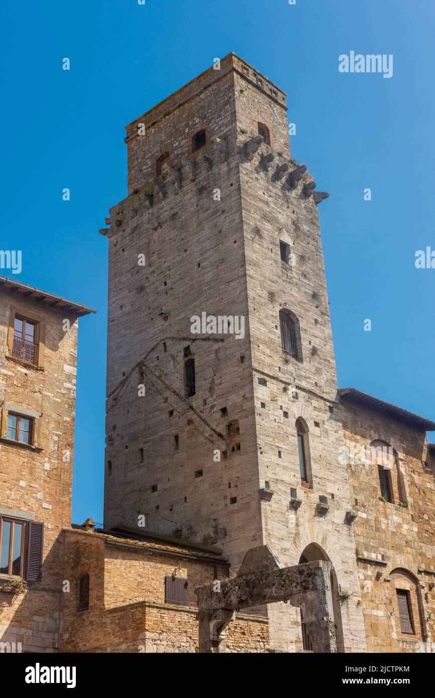 Ancient medieval tower in the town center of San Gimignano, Tuscany ...