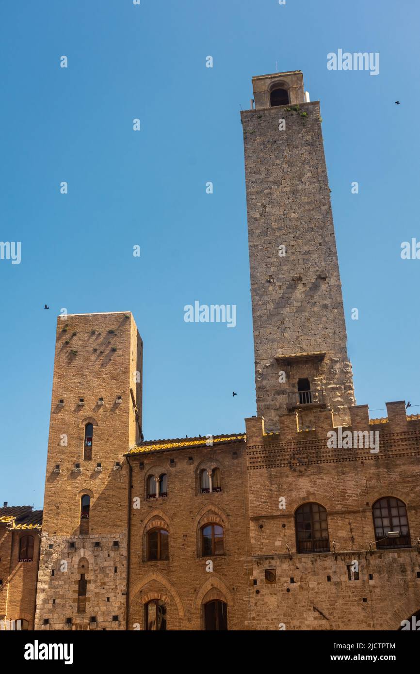 Ancient medieval tower in the town center of San Gimignano, Tuscany ...