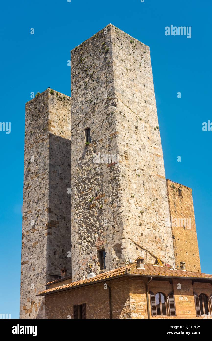Ancient medieval tower in the town center of San Gimignano, Tuscany ...