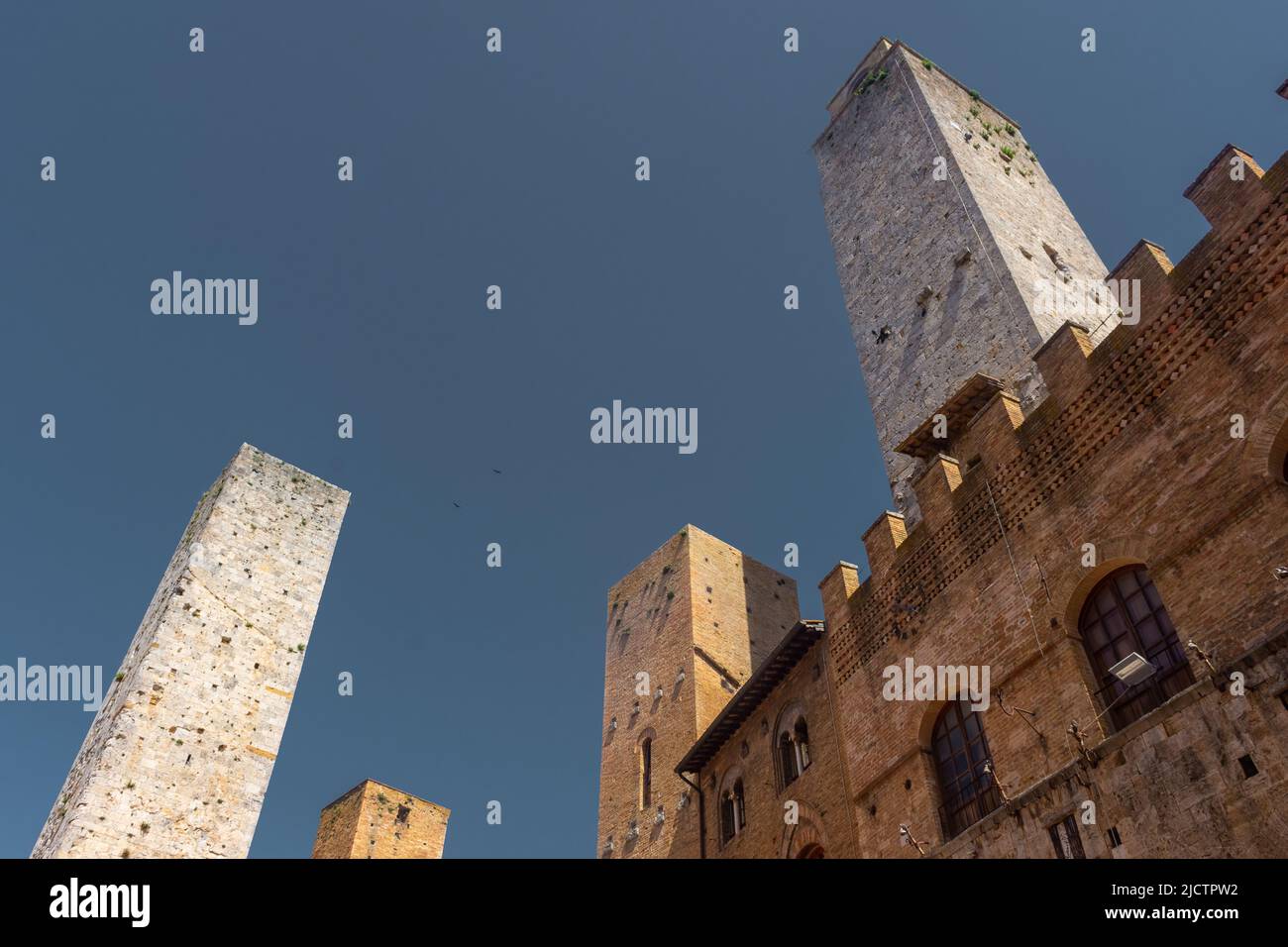 Ancient medieval tower in the town center of San Gimignano, Tuscany ...