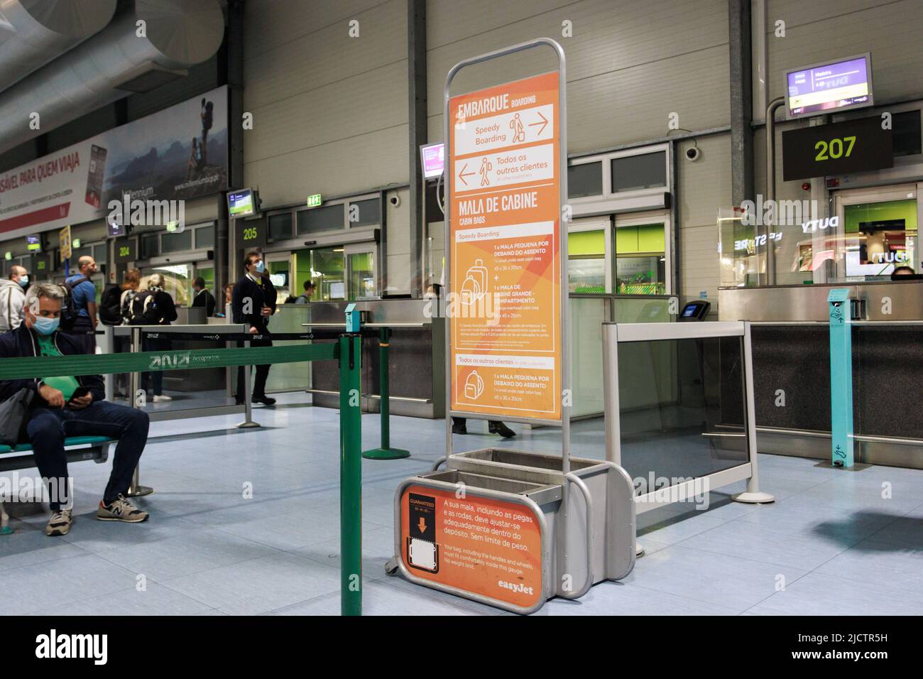 EasyJet check-in cabin baggage size checker at the boarding gate of Lisbon Airport. Stock Photo