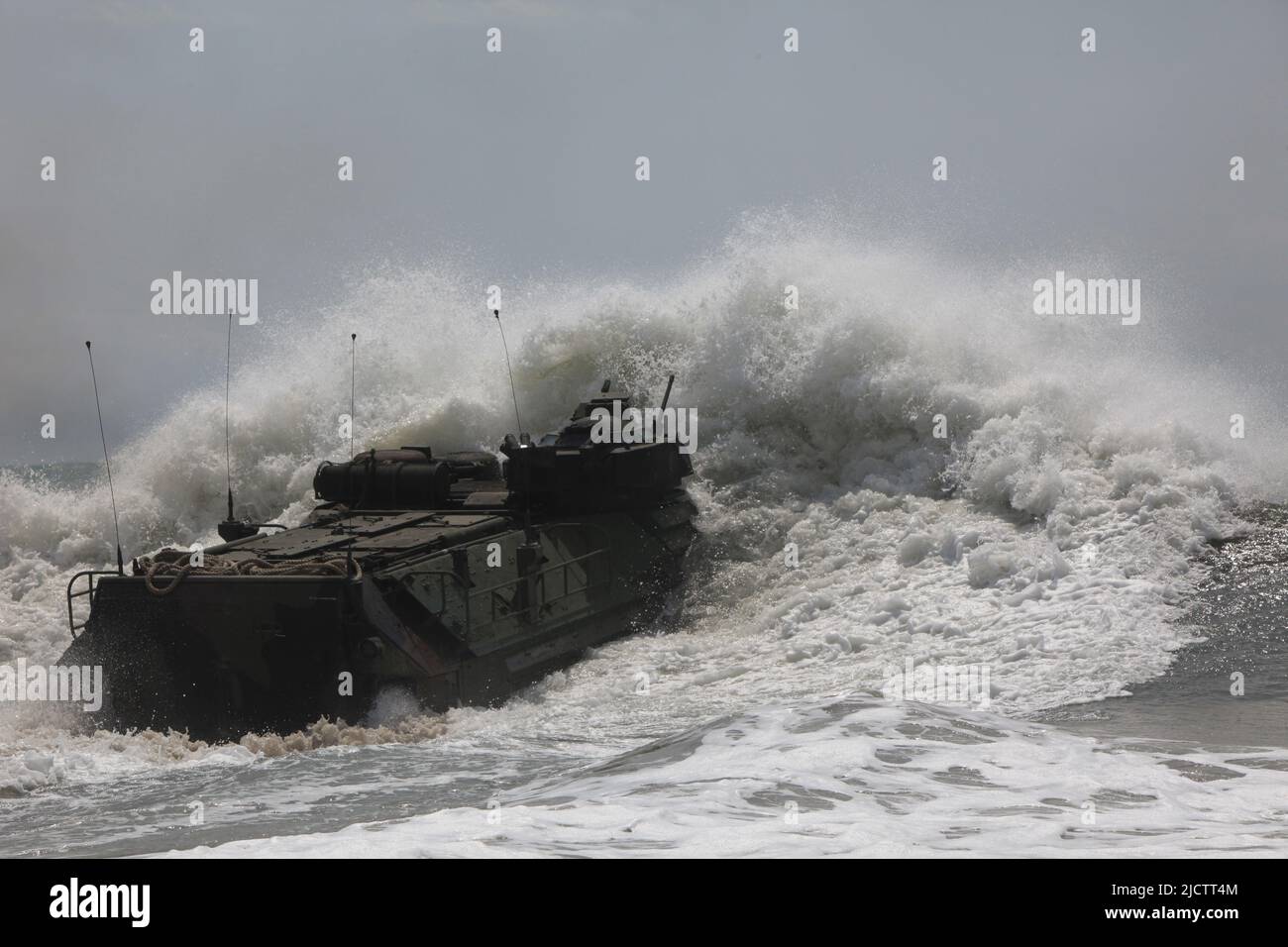 US Marine Corps AAV battles the surf. Stock Photo