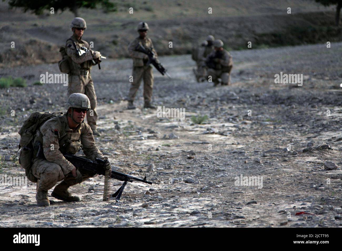 U.S. Marines with 1st Battalion, 8th Marine Regiment (1/8), Regimental Combat Team 6, halt during a security patrol in the Fulads, Helmand province, A Stock Photo