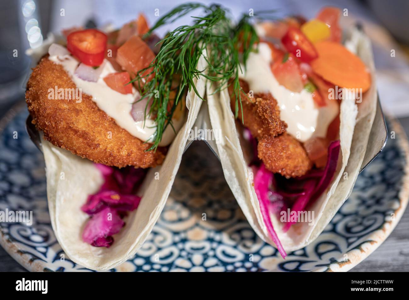 Tacos with panko fried prawns served at a restaurant in Norrkoping Sweden Stock Photo