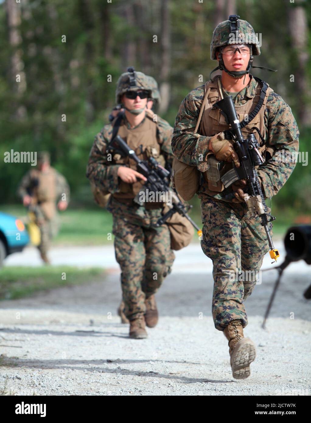 U.S. Marines with 3rd Squad, 3rd Platoon, Bravo Company, 1st Battalion, 8th Marine Regiment (1/8), 2D Marine Division, move to clear out multiple buil Stock Photo