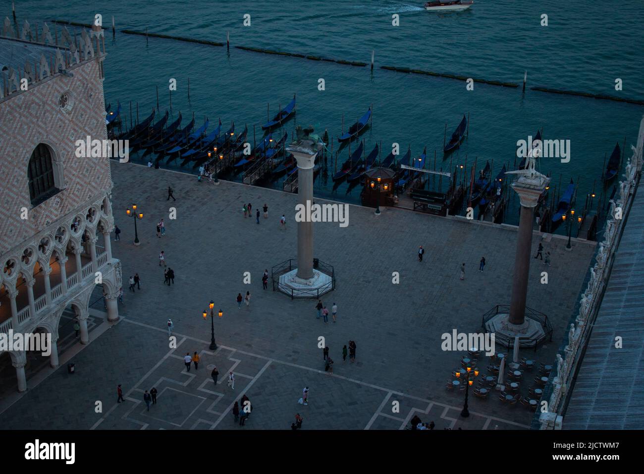 Gondolas along the Doge’s palace and Piazzetta San Marco, the view from Campanile di San Marco late in the evening, Venice, Italy Stock Photo