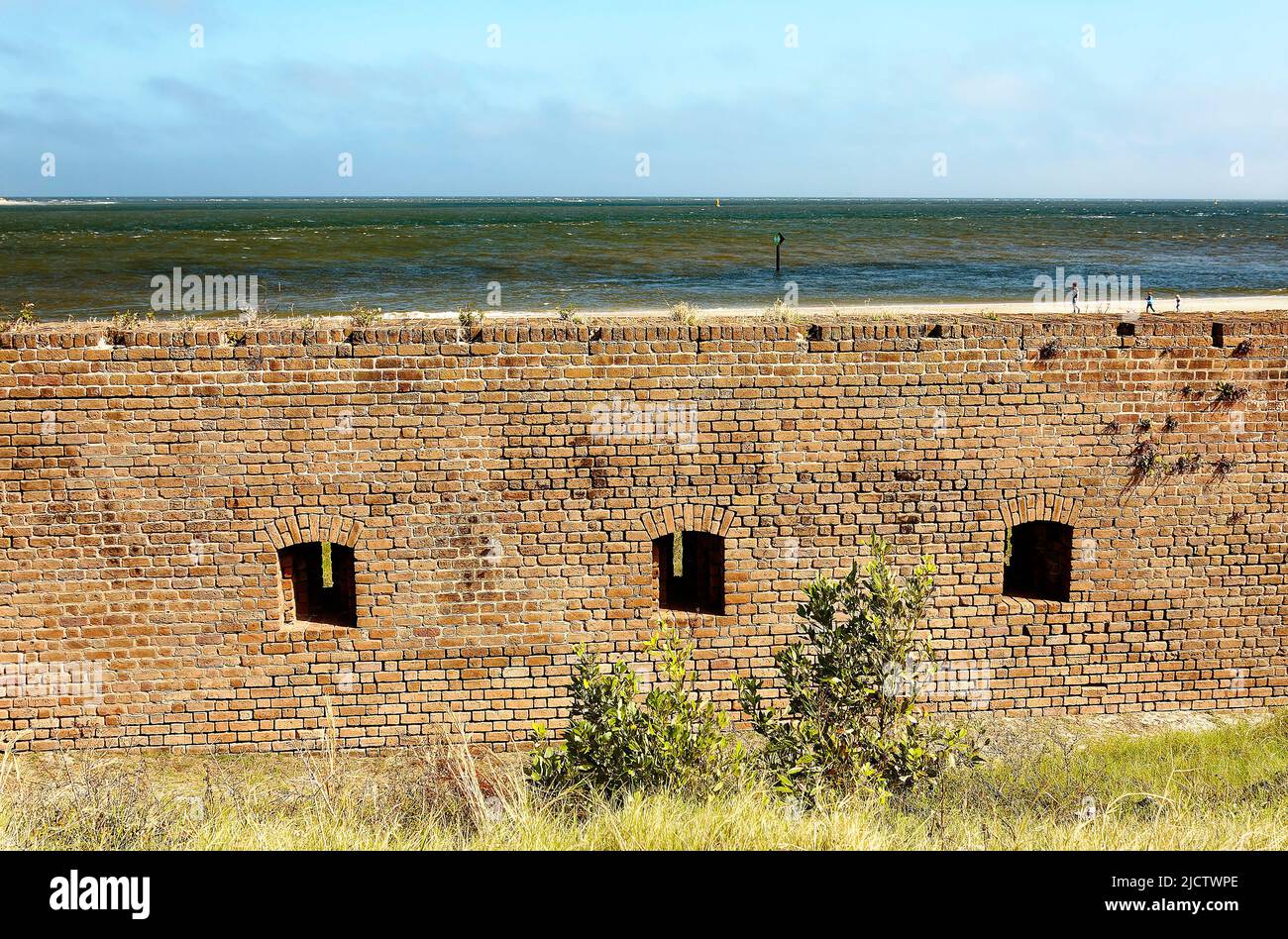 Fort Clinch State Park; outside brick wall, gun openings, Atlantic Ocean beyond, historic, 1847, Third System Fortification, National Register of Hist Stock Photo