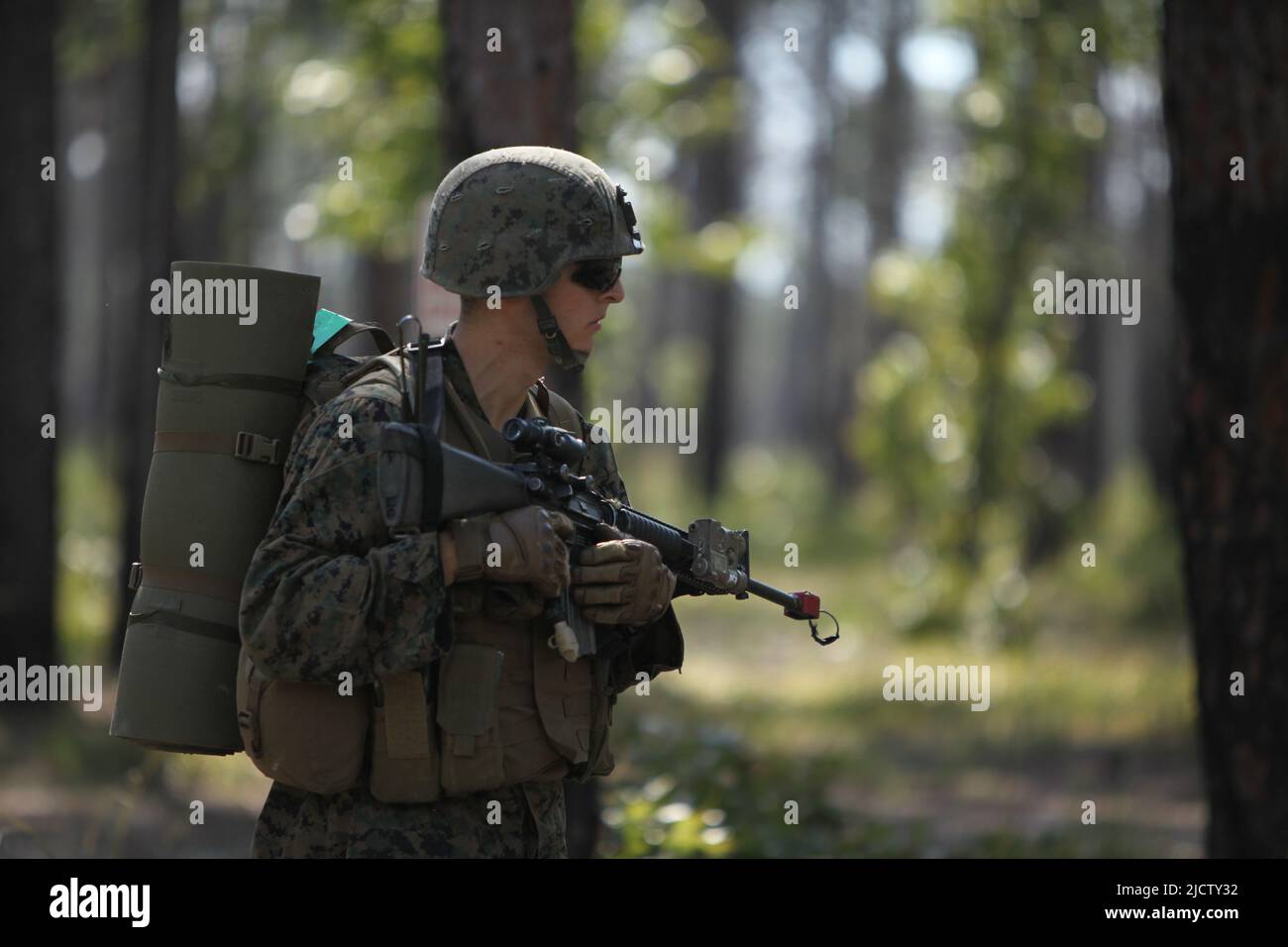 A U.S. Marine with Charlie Company, 1st Battalion, 8th Marine Regiment (1/8), 2D Marine Division, is patrolling through Combat Town during their Deplo Stock Photo