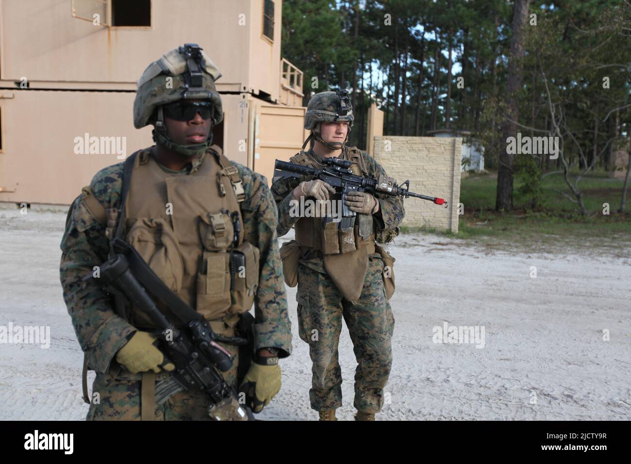 U.S. Marines with Charlie Company, 1st Battalion, 8th Marine Regiment (1/8), 2D Marine Division, conduct a patrol throrugh Combat Town during their De Stock Photo