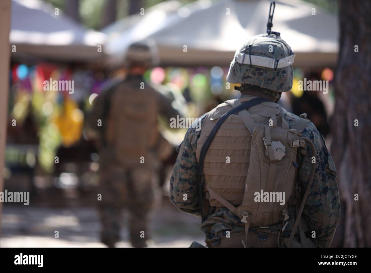 U.S. Marines with Charlie Company, 1st Battalion, 8th Marine Regiment (1/8), 2D Marine Division, are patrolling through a simulated market place in Co Stock Photo