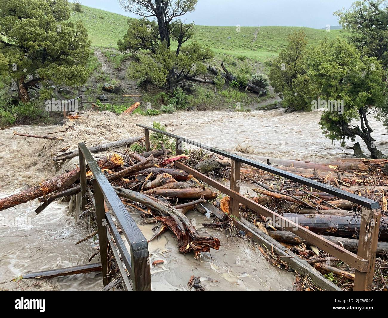 Yellowstone, United States. 13th June, 2022. Raging high water washes out a bridge at Rescue Creek after record rains and snow melt caused destructive floods closing Yellowstone National Park at the start of the high season, June 13, 2022 in Yellowstone, Montana. Credit: Jacob W. Frank/NPS Photo/Alamy Live News Stock Photo