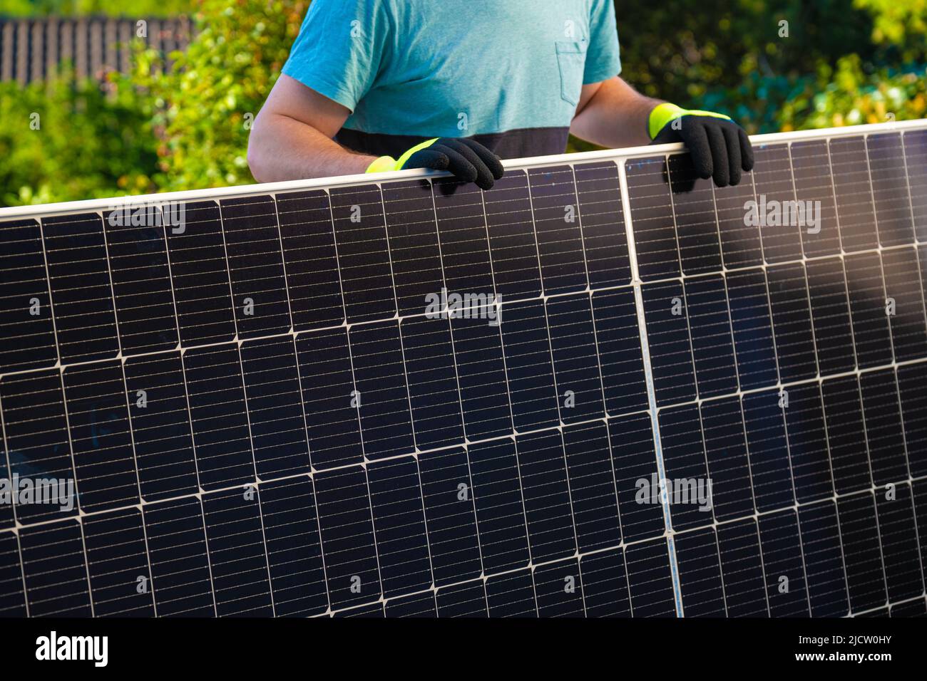 Solar energy.Green energy. Solar panel in the hands of a worker . Fitting and installation of