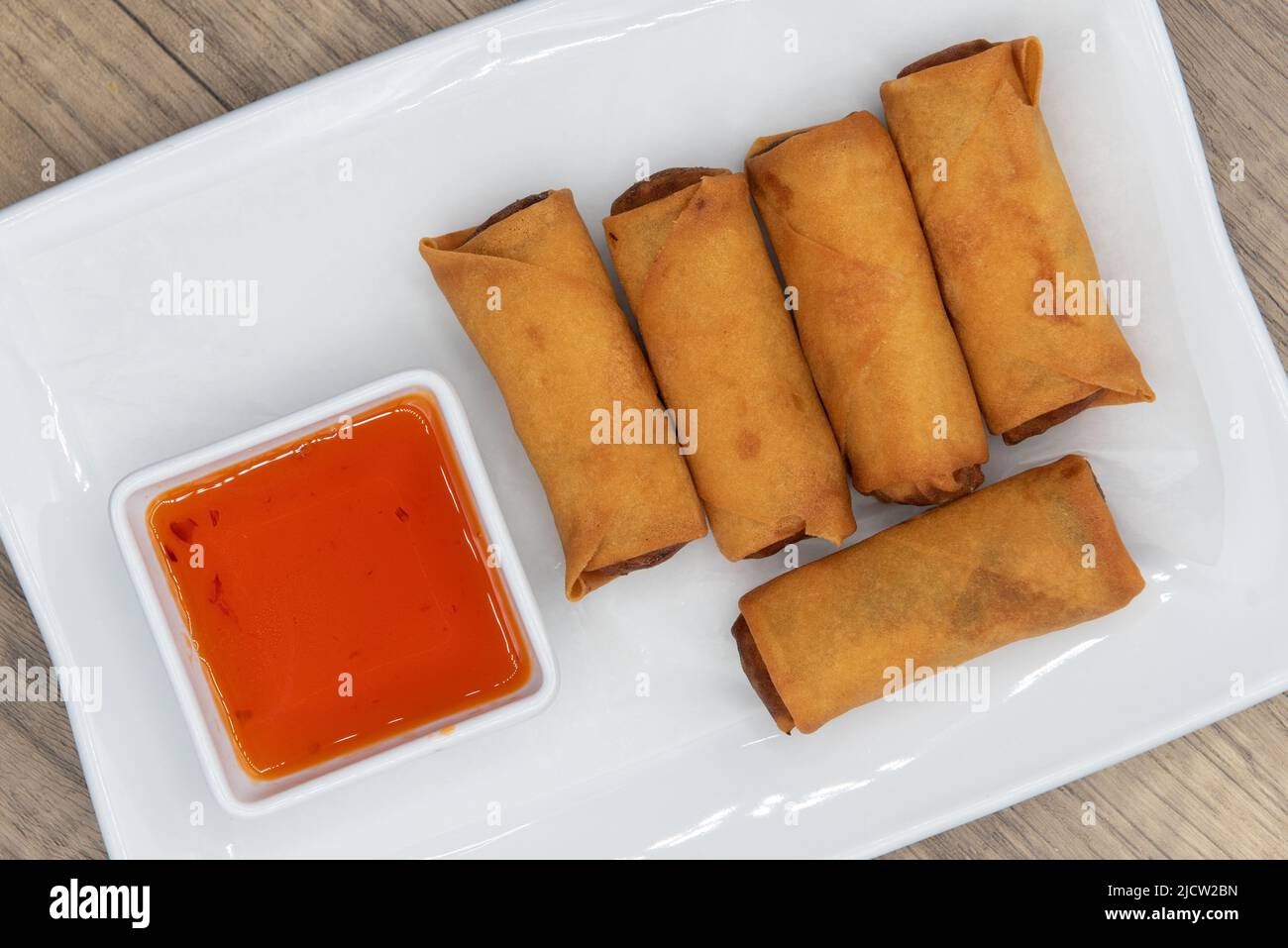 Overhead view of tempting side order of crispy crunchy egg rolls with