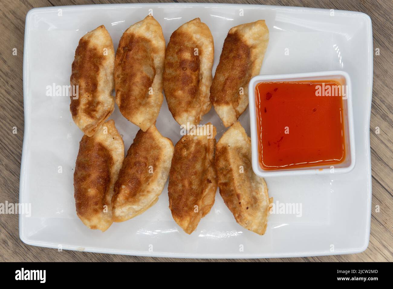Overhead view of crunchy side order of spicy thai dumplings crispy and perfect as an appetizer. Stock Photo