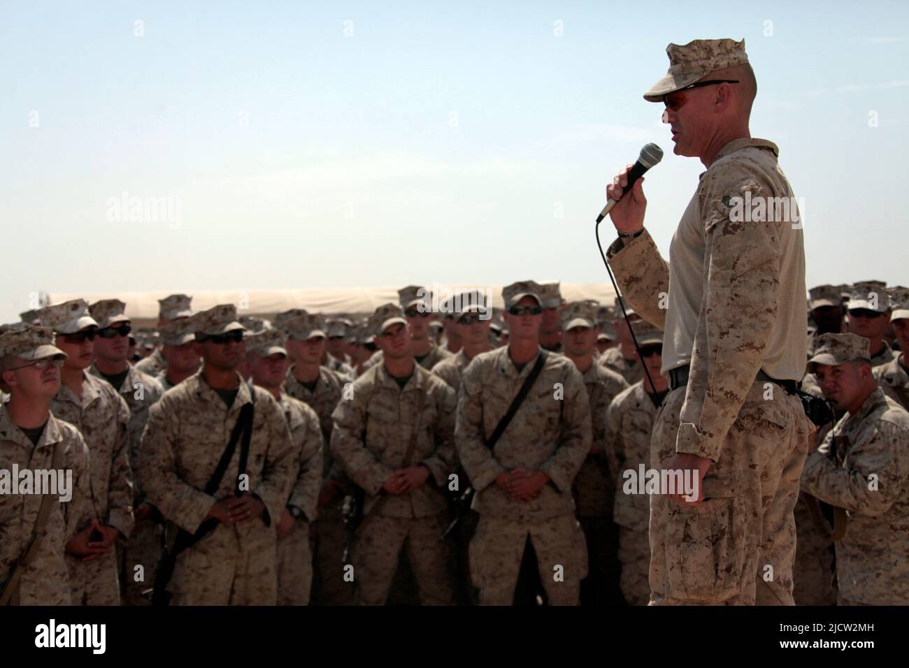 US Marine speaks to fellow Marines about completing their mission while deployed to the Helmond Province, Afghanistan. Stock Photo