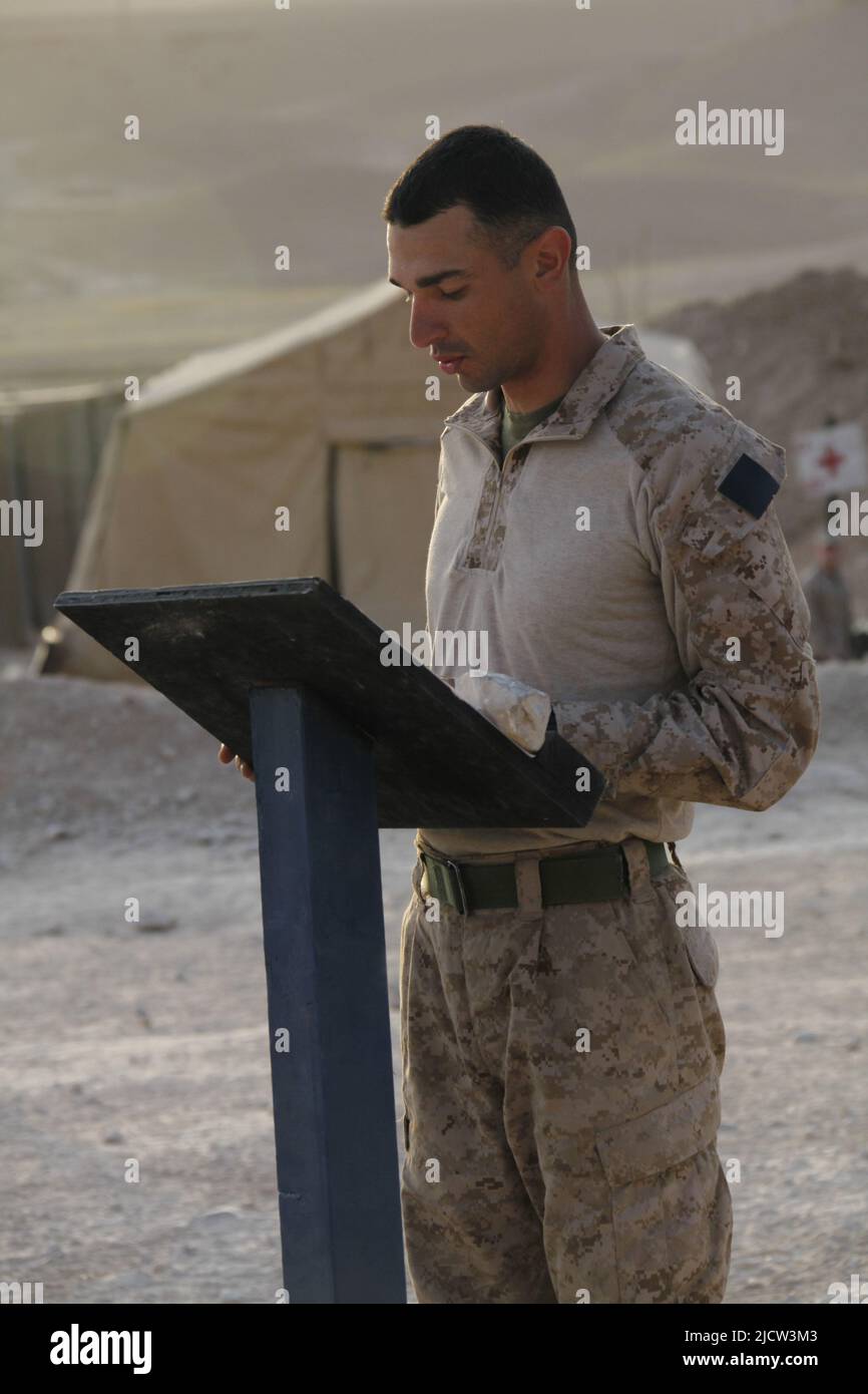 US Marines with 1st Battalion, 8th Marine Regiment perform an Easter ceremony while forward deployed to Kajaki, Helmond Province, Afghanistan. Stock Photo