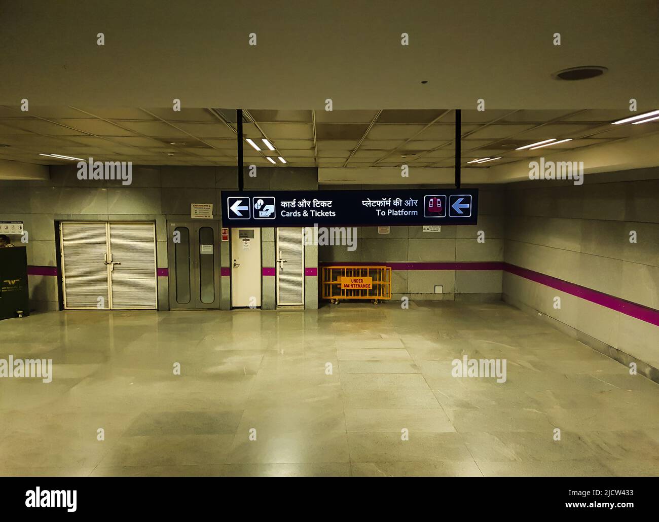 isolated metro station with sign board showing the way of ticket counter at day image is taken at delhi metro station new delhi india on Apr 10 2020. Stock Photo