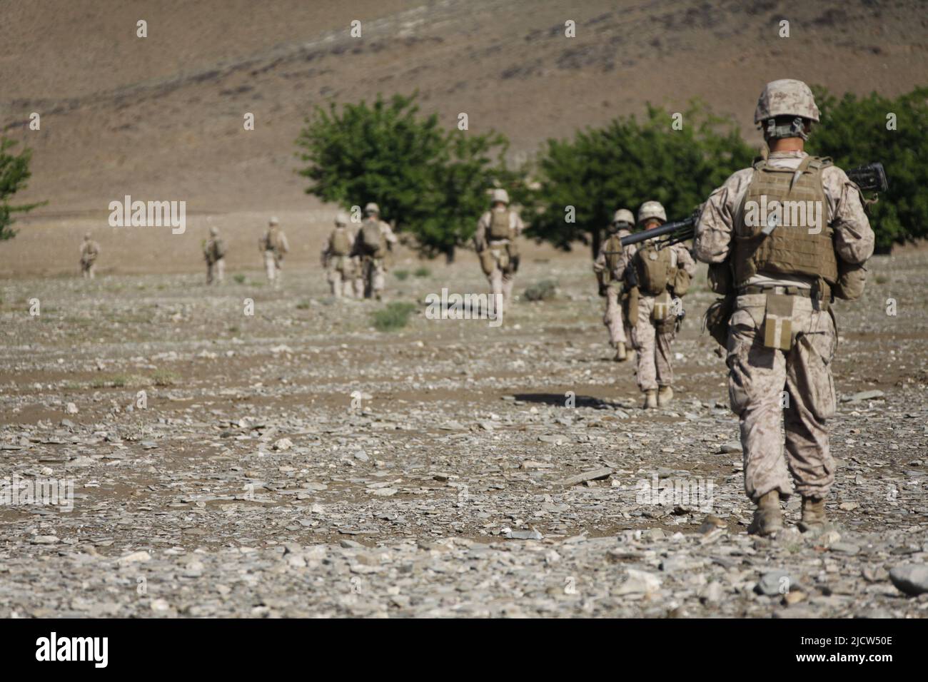 U.S. Marines with 1st Battalion, 8th Marine Regiment (1/8), Regimental Combat Team 6, patrol into the village of Payawak, Helmand province, Afghanista Stock Photo