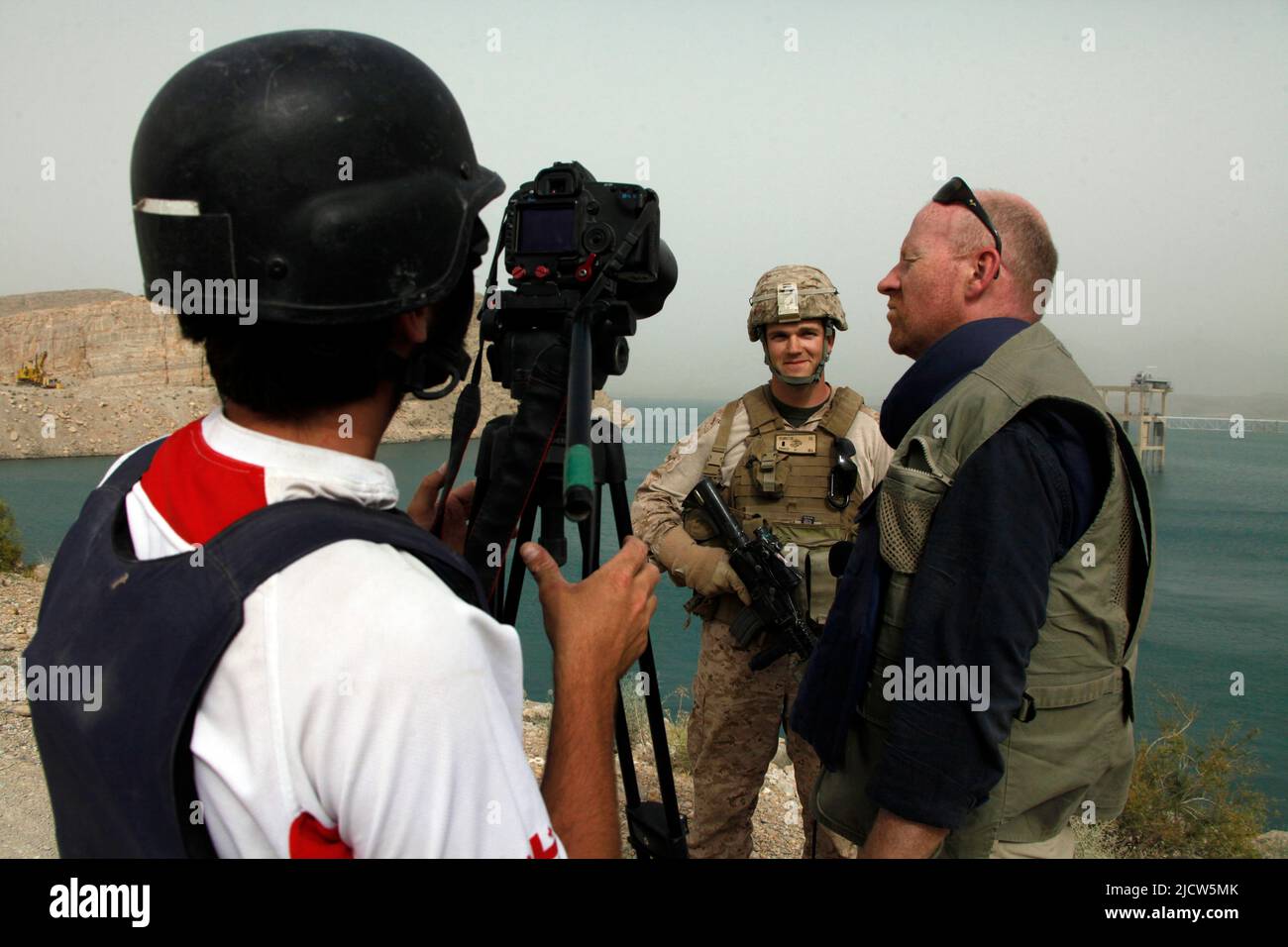 Bernard Smith, center, reporter, and Ben Foley, right, cameraman, with Al Jazeera English News Channel interviews U.S. Marine Corps 2nd Lt. Darren Rem Stock Photo